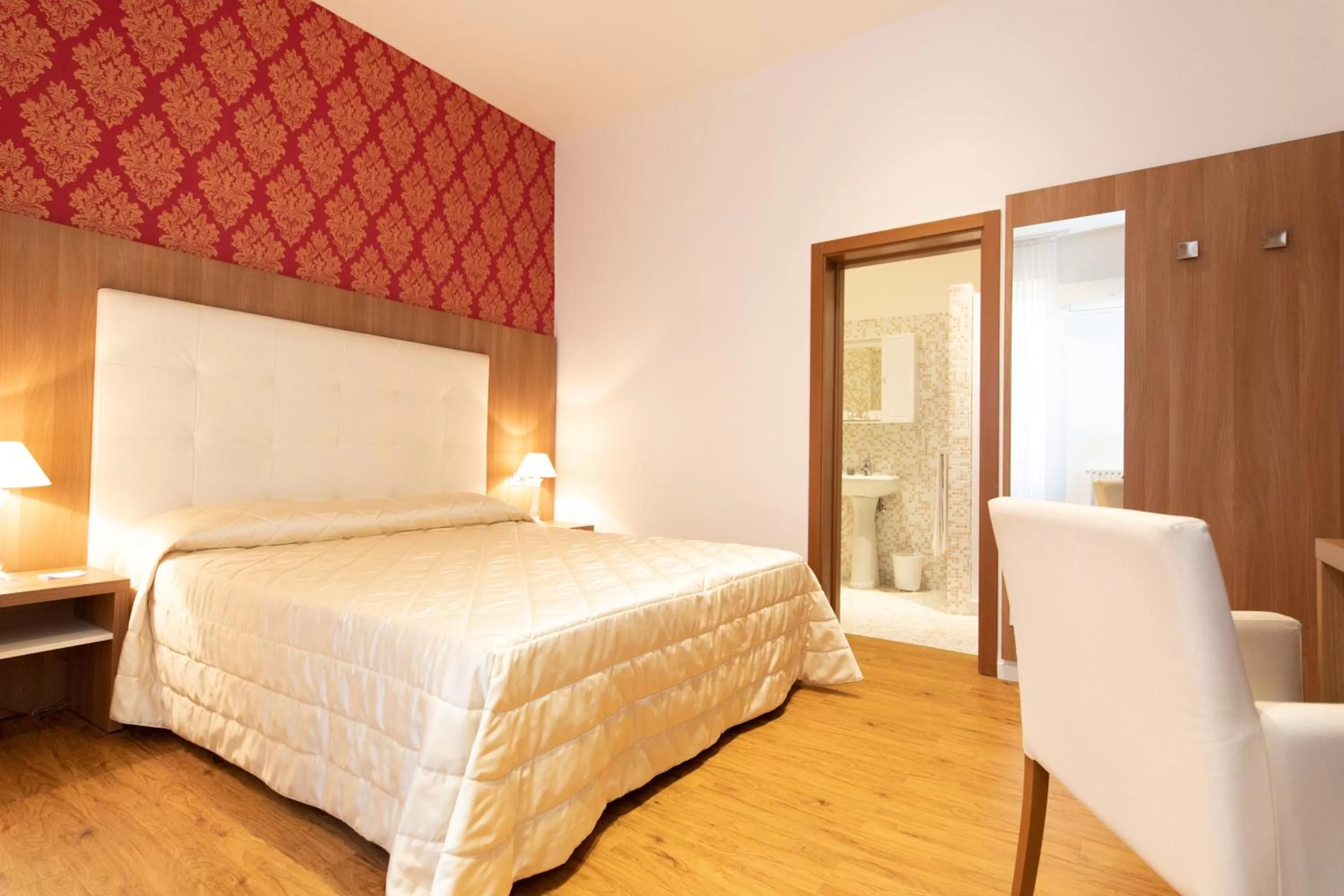 Photo of the whole room, Bed in Albergo Rossini 1936