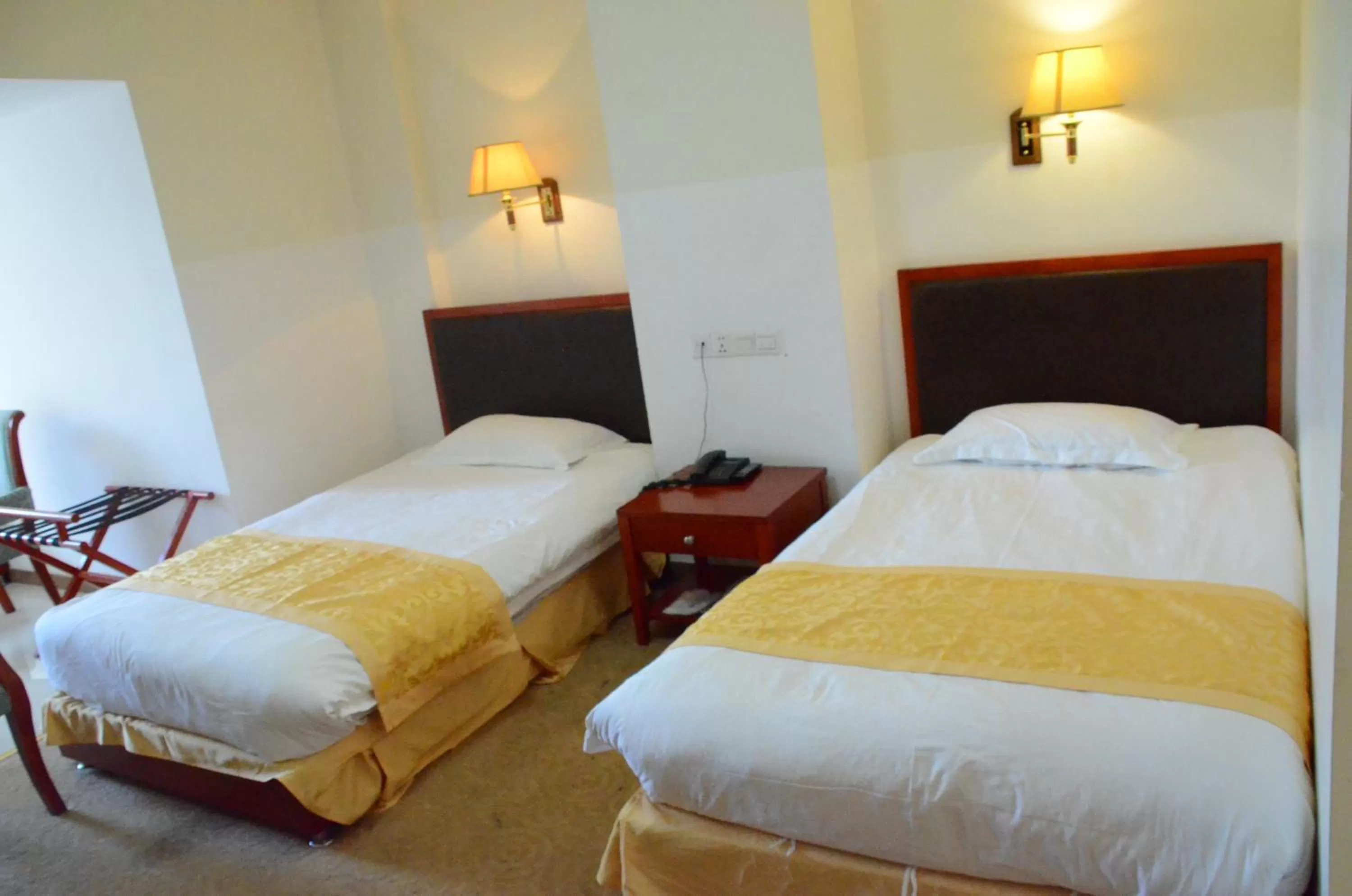 Bed in Soluxe Club International Hotel