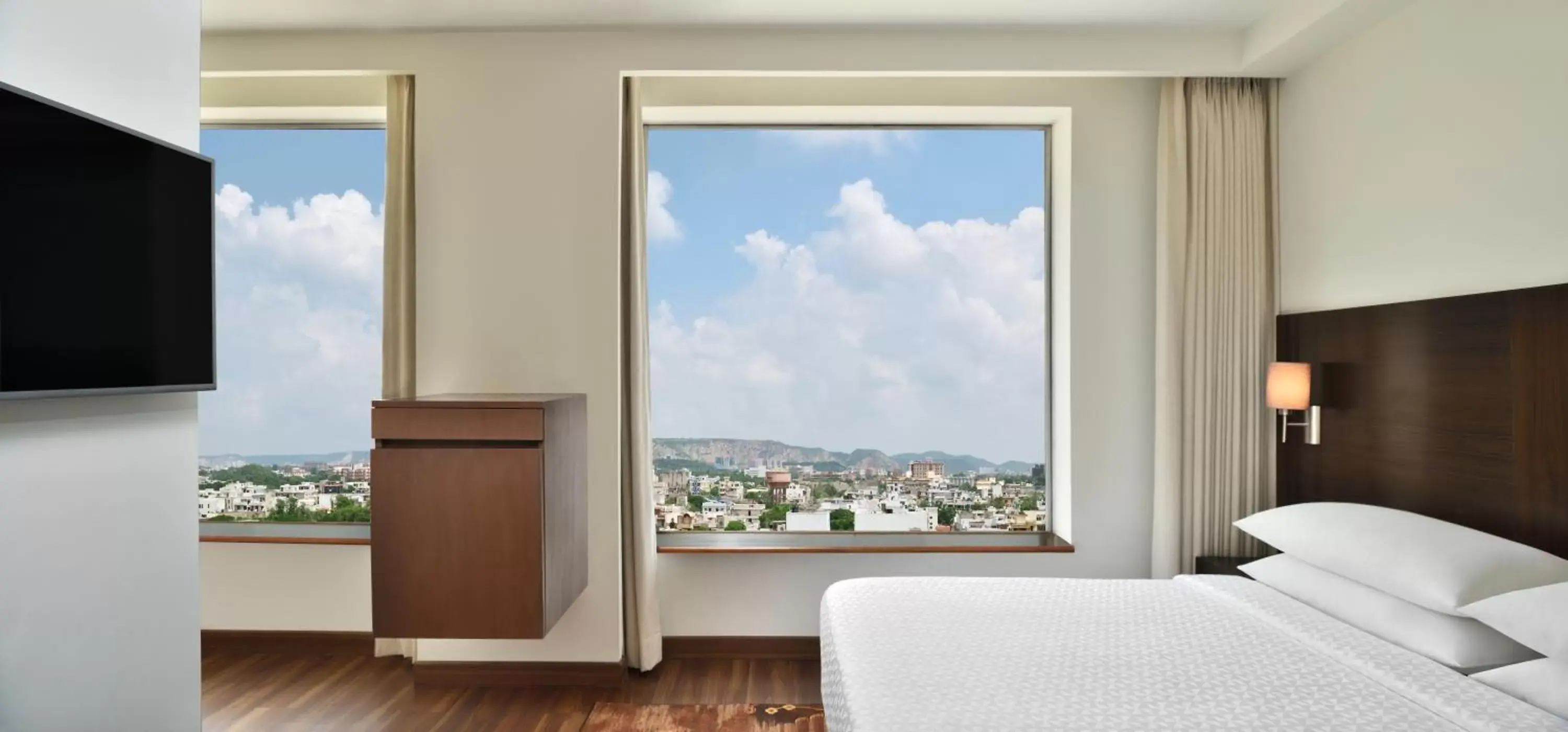 Deluxe Suite(15 Mins comp Head Massage, High Tea, (4-5PM), 20% off on SPA, Laundry and Food & Soft Beverages only at The Eatery, One way Airport/Railway Transfer complimentary, Credit Meal of INR 1000/- in a the stay on Minimum bill amount of INR 2500/-) - single occupancy in Four Points by Sheraton Jaipur, City Square Deluxe Suite(15 Mins comp Head Massage, High Tea, (4-5PM), 20% off on SPA, Laundry and Food & Soft Beverages only at The Eatery, One way Airport/Railway Transfer complimentary, Credit Meal of INR 1000/- in a the stay on Minimum bill amount of INR 2500/-) - single occupancy in Four Points by Sheraton Jaipur, City Square