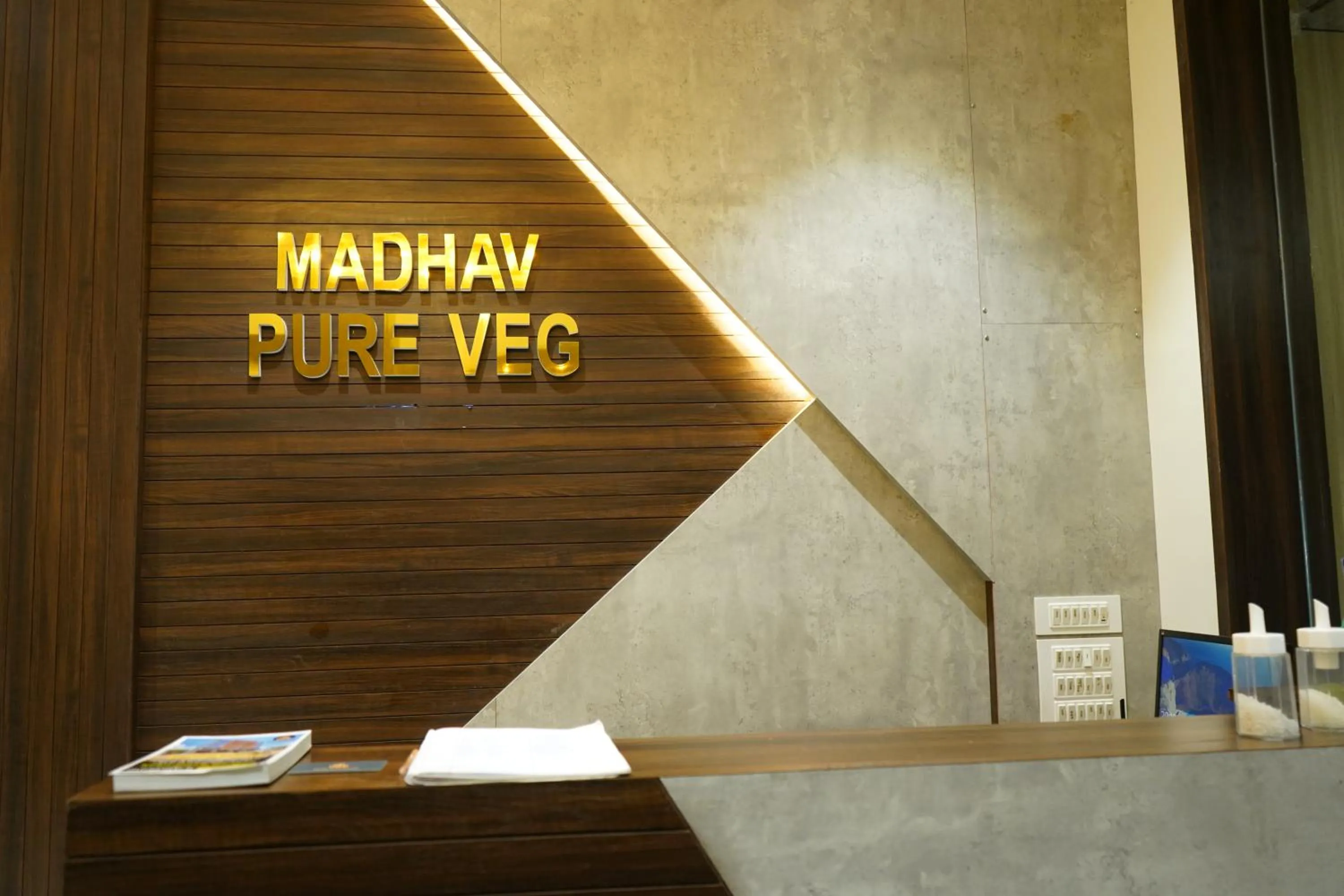 Property logo or sign in Hotel Madhavan International