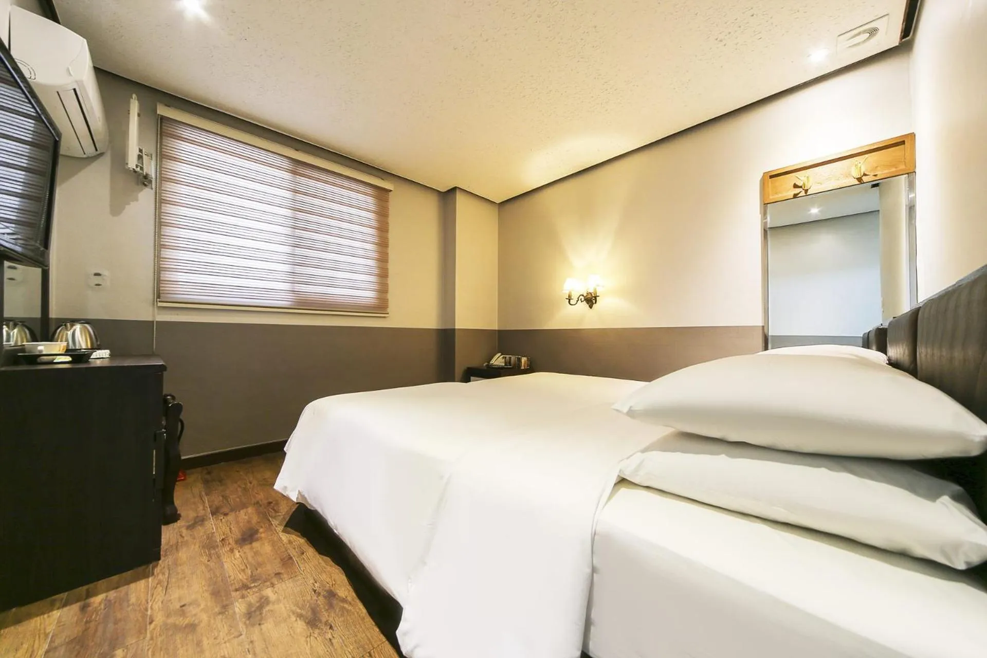 Bed in Friendly DH Naissance Hotel by Mindrum Group