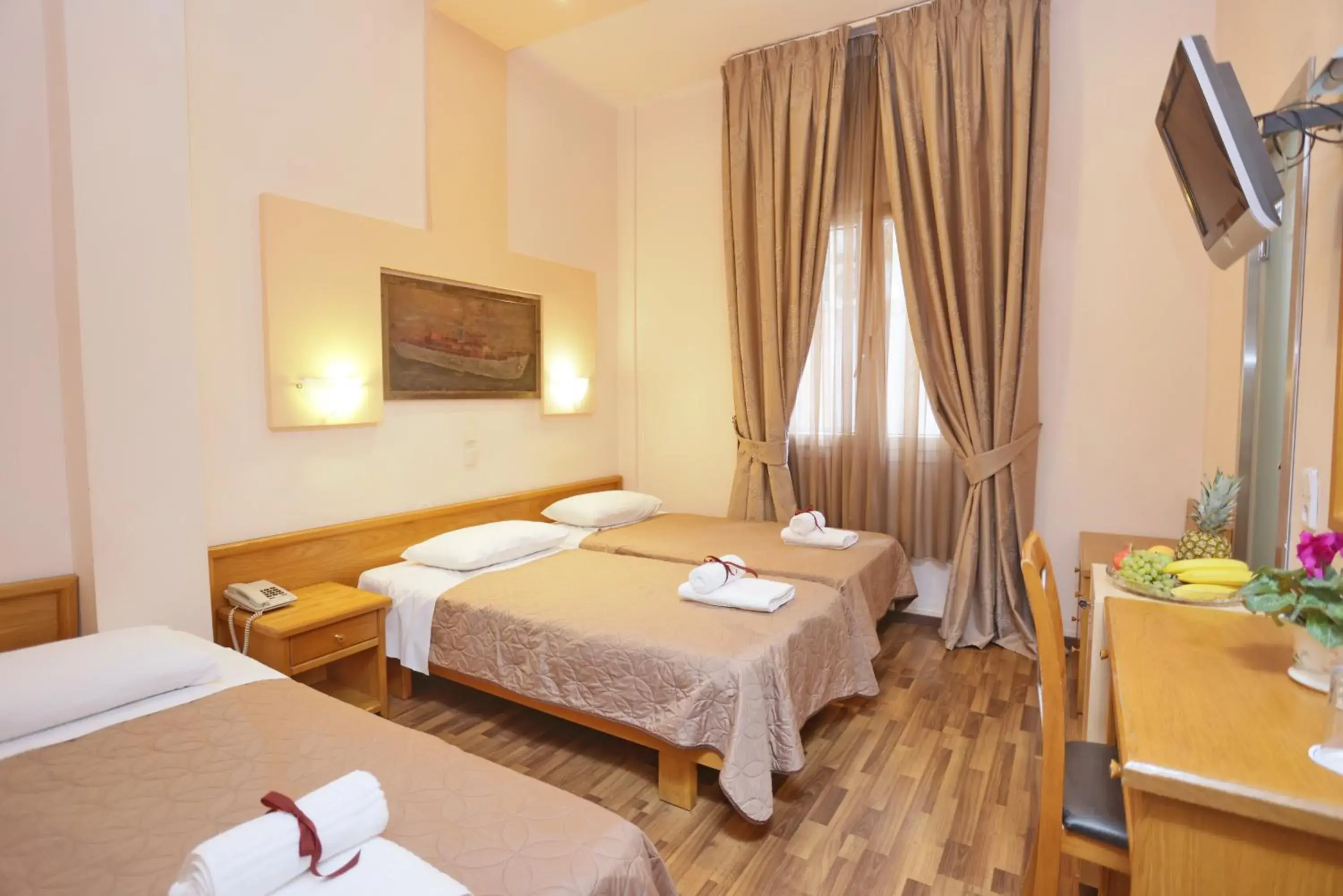 Triple Room in Aegeon Hotel Triple Room in Aegeon Hotel