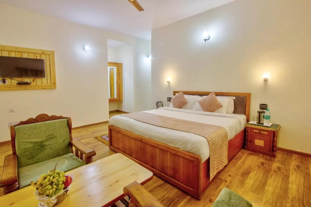 Bed in Ayushman Hotels