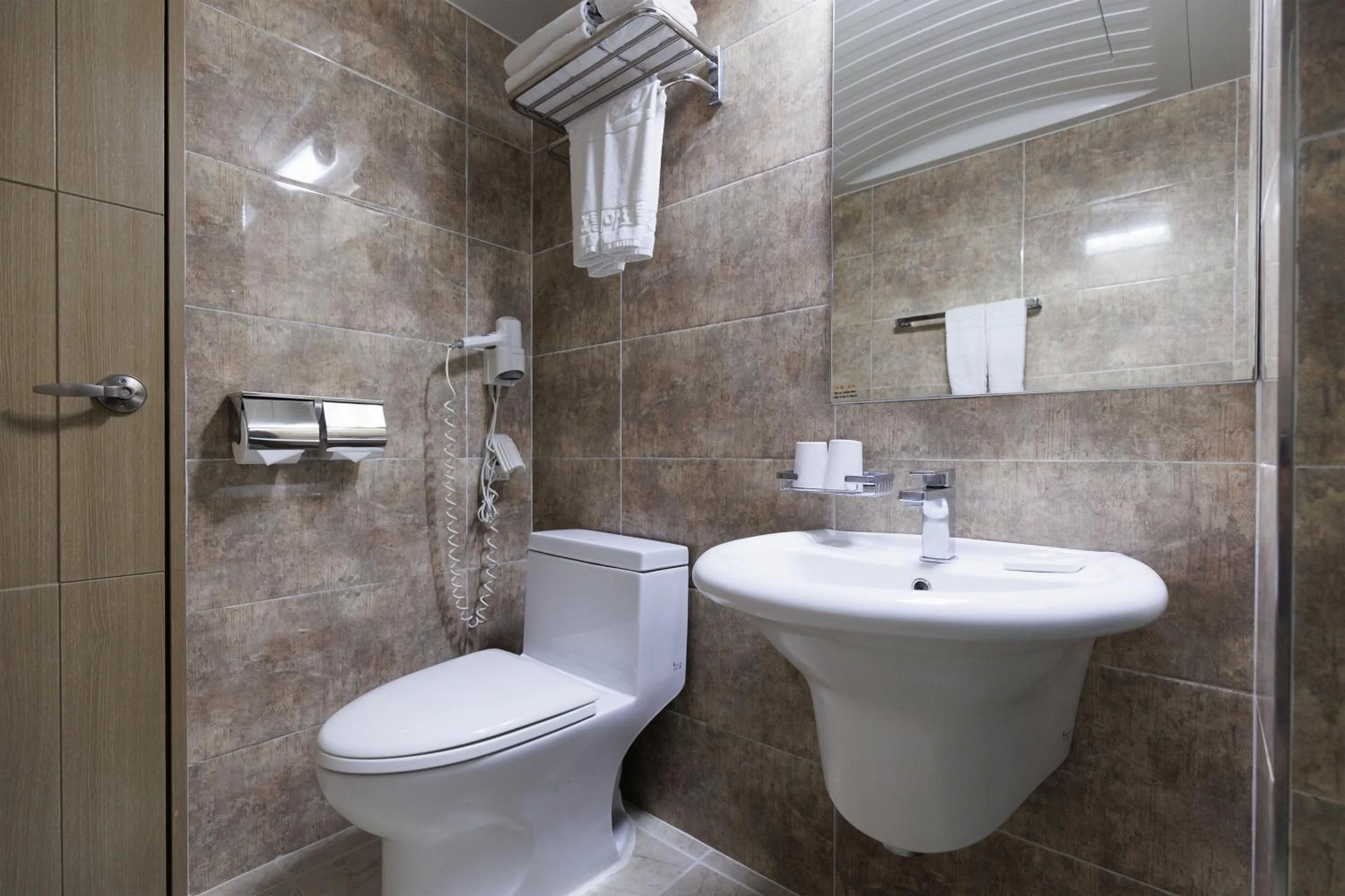 Photo of the whole room in Benikea Hotel Jeju