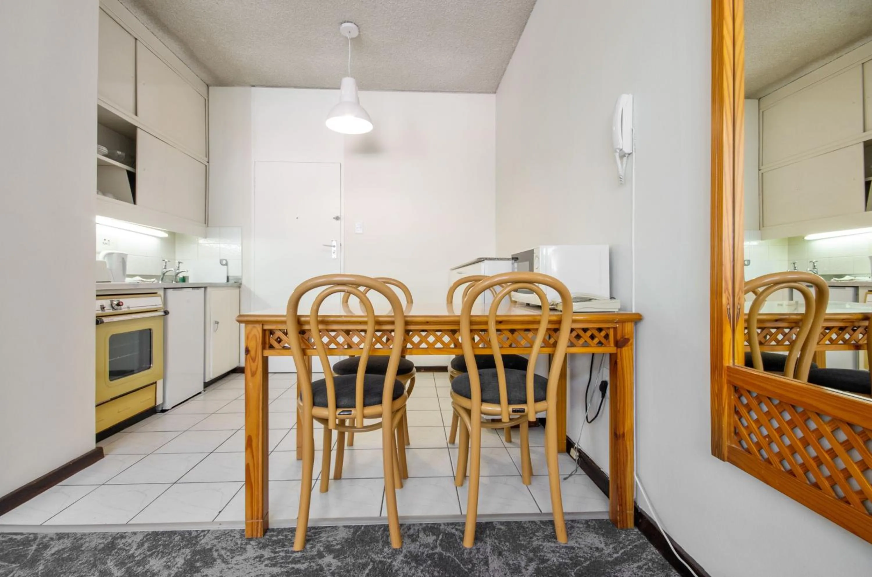 Dining area in Gardens Centre Holiday Apartments
