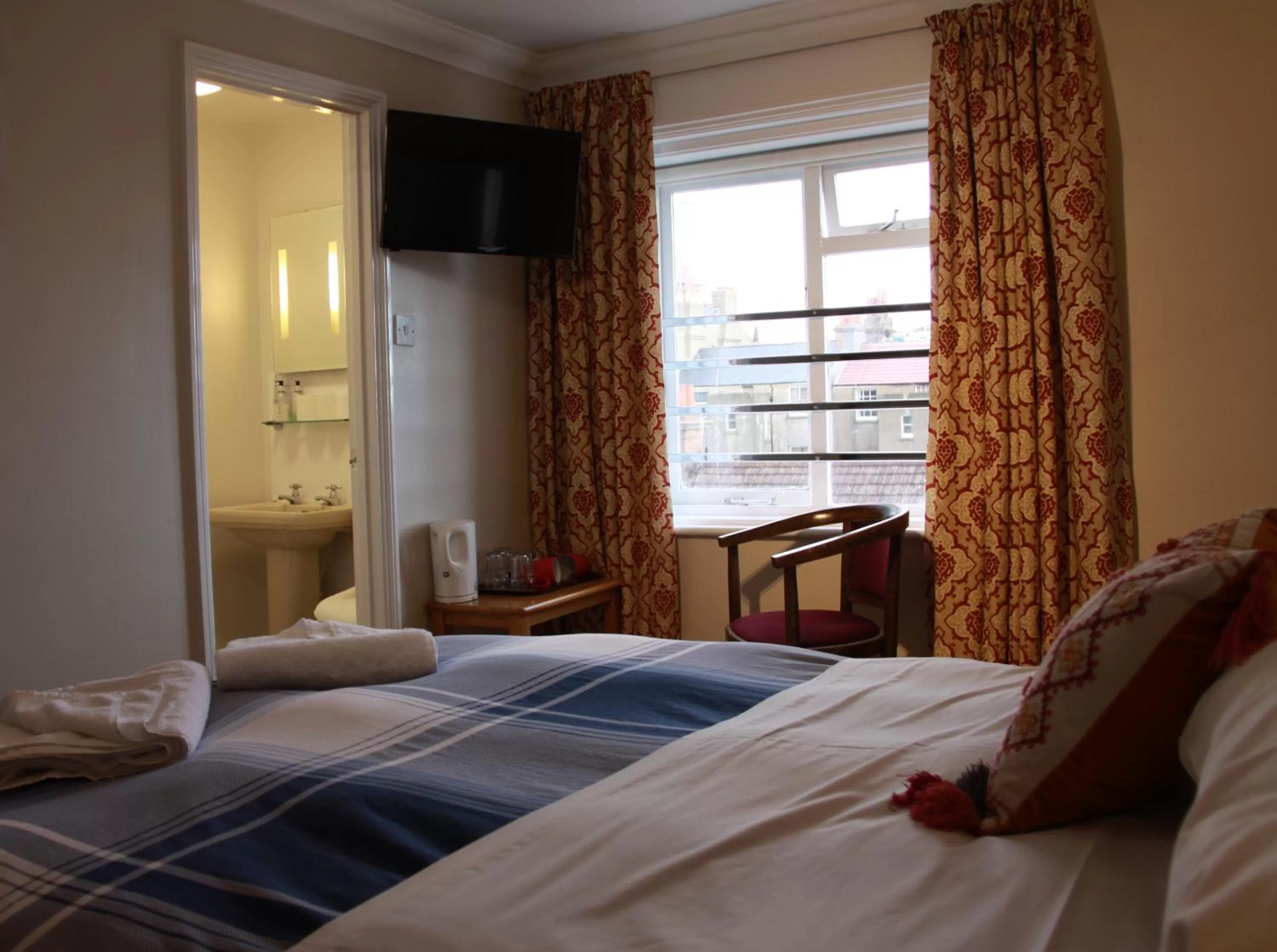 Bed in Ambassador Hotel