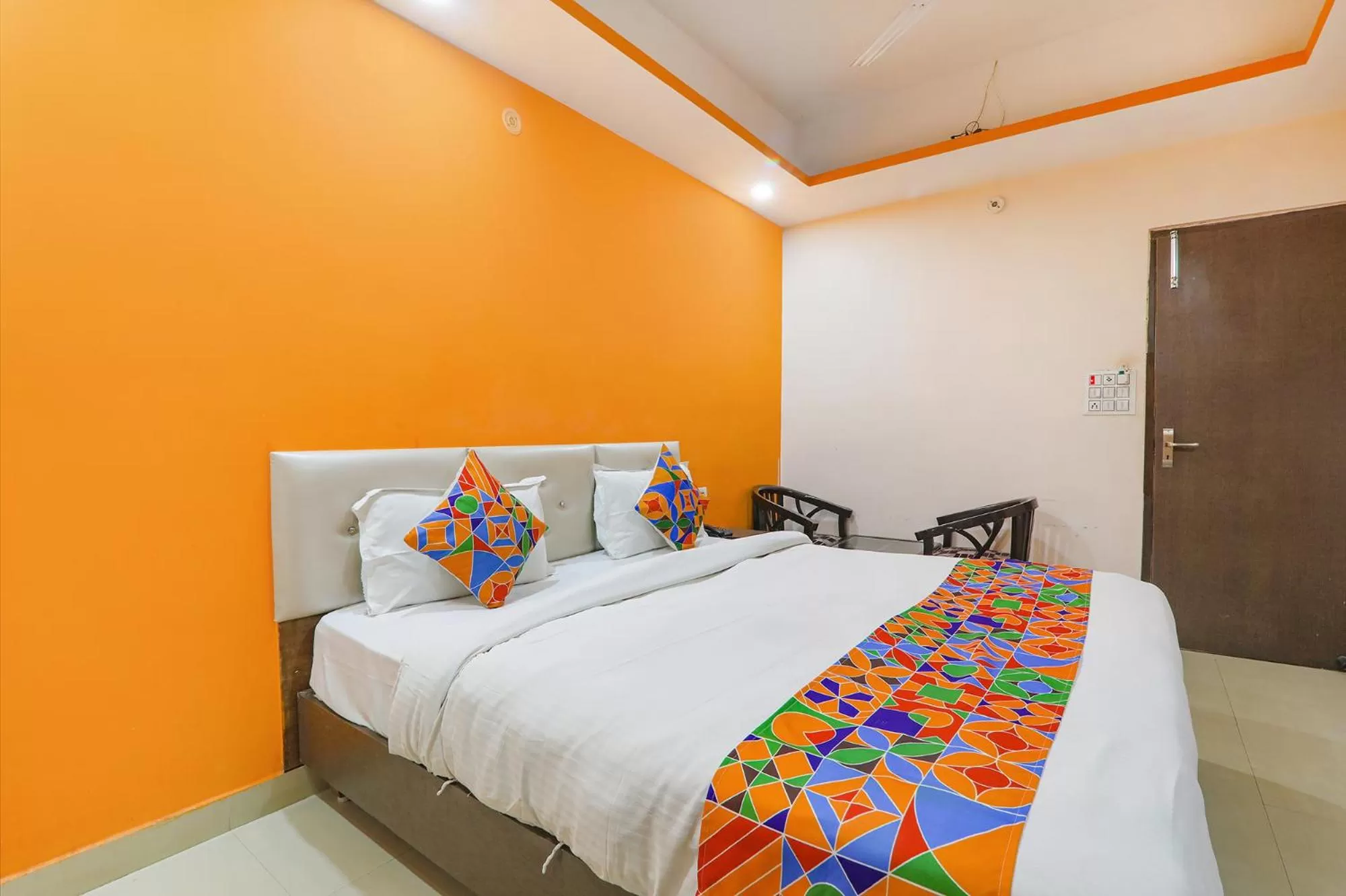 Bed in FabHotel Vinayaka