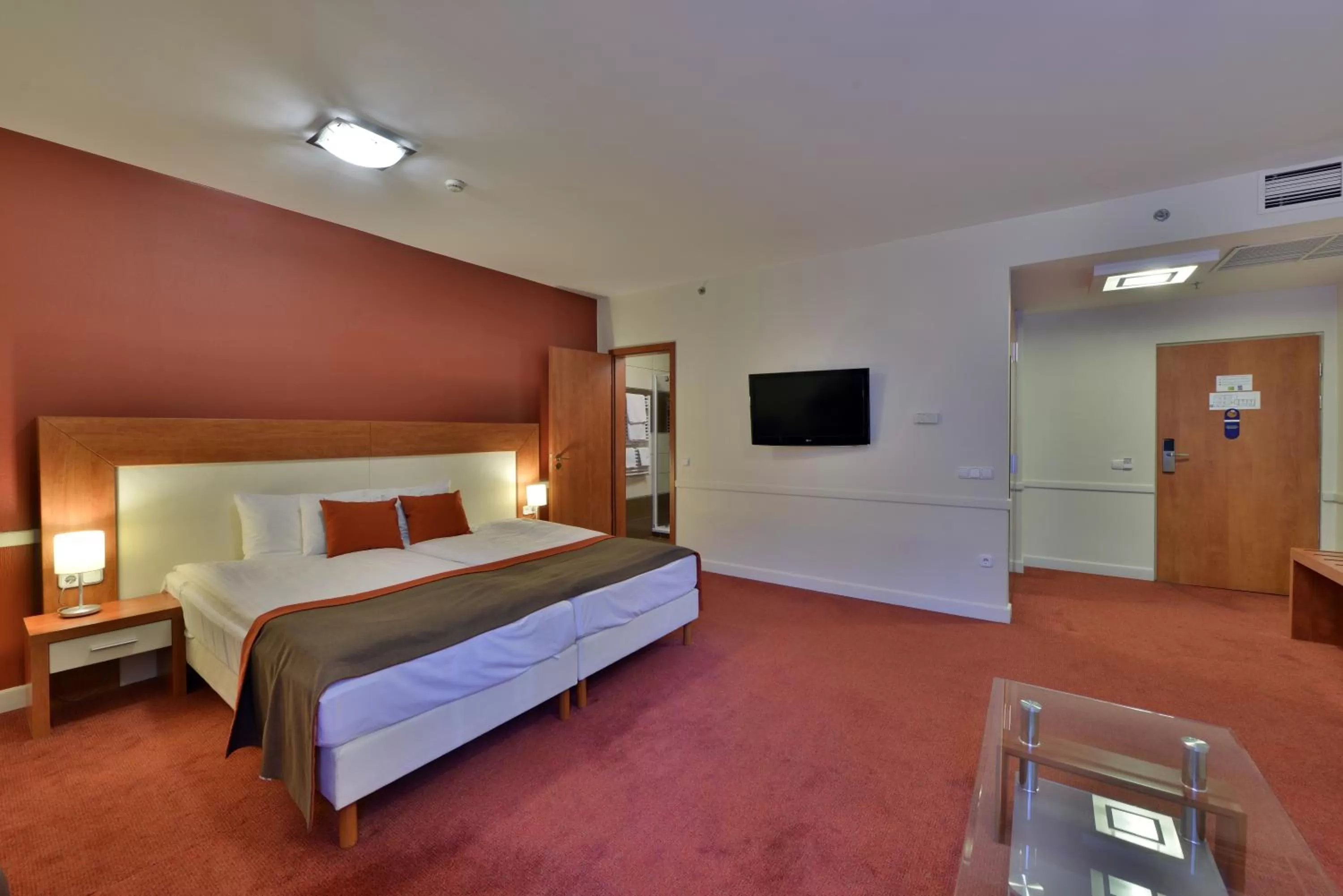 Living room, Bed in Hotel City Inn