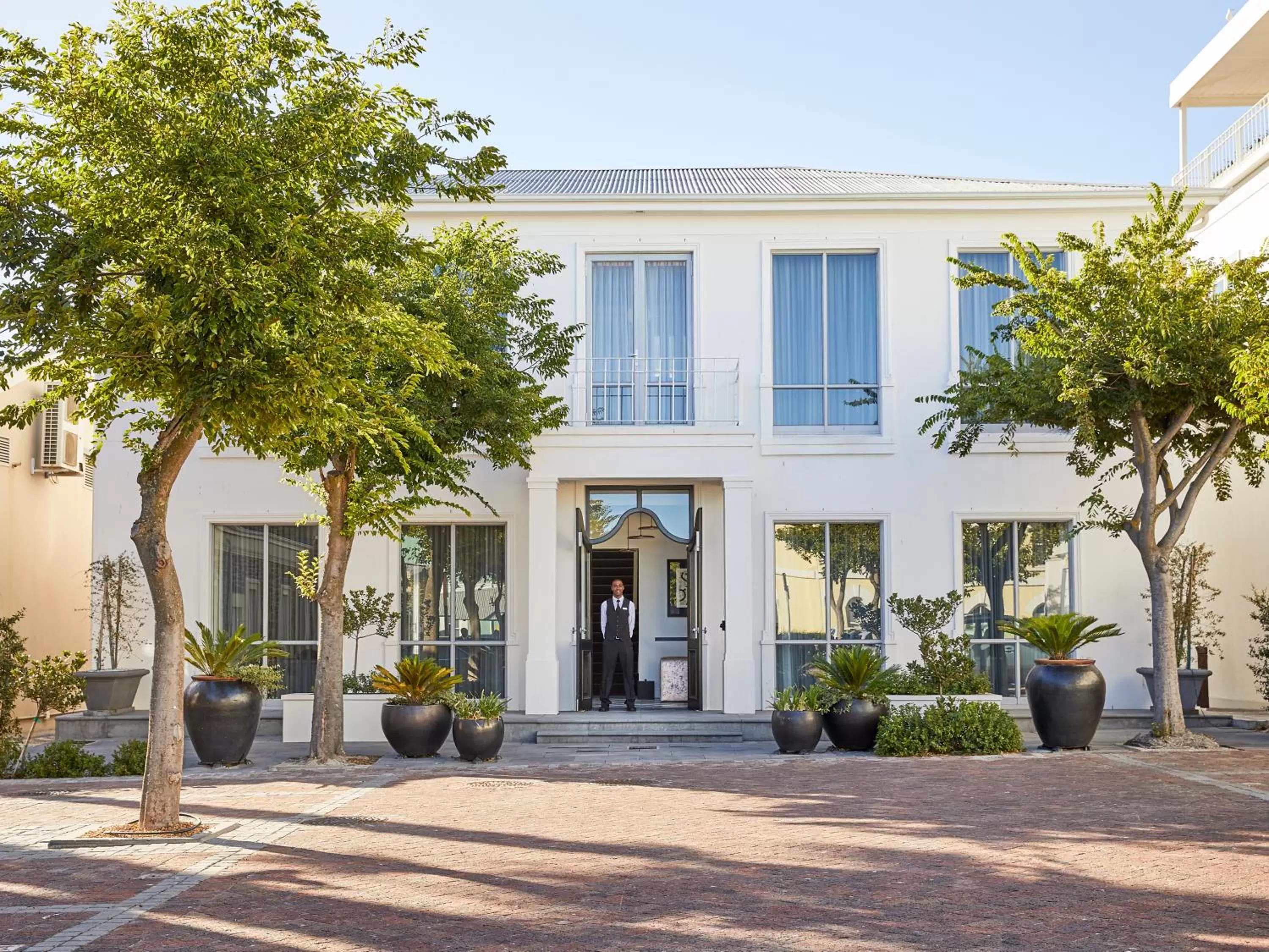 Facade/entrance in The Manor House at the Queen Victoria Hotel by NEWMARK