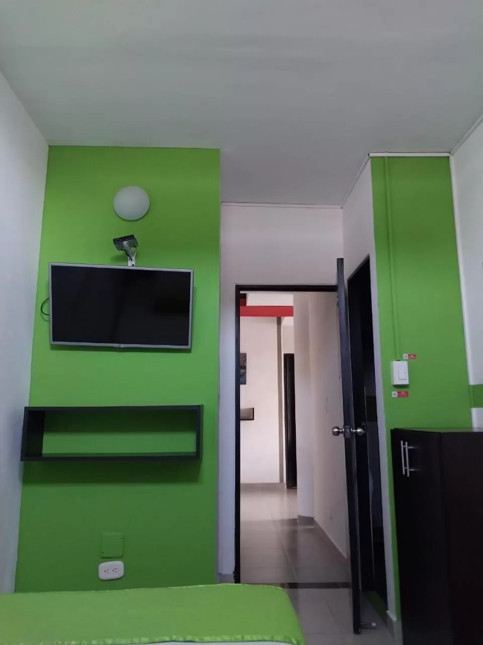 Photo of the whole room, TV/Entertainment Center in HOTEL COLOURS Cali