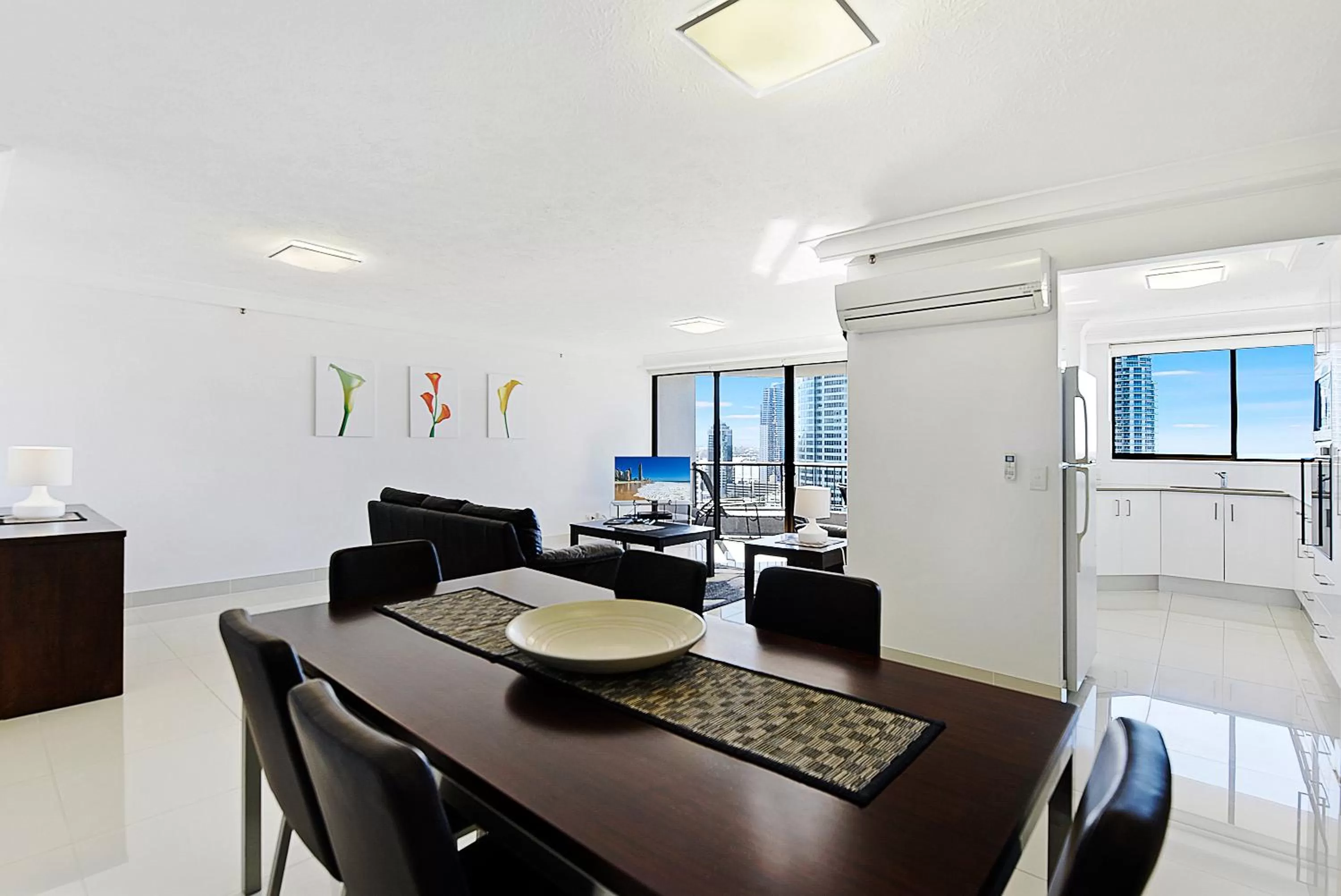 Dining area in Surfers Century Oceanside Apartments