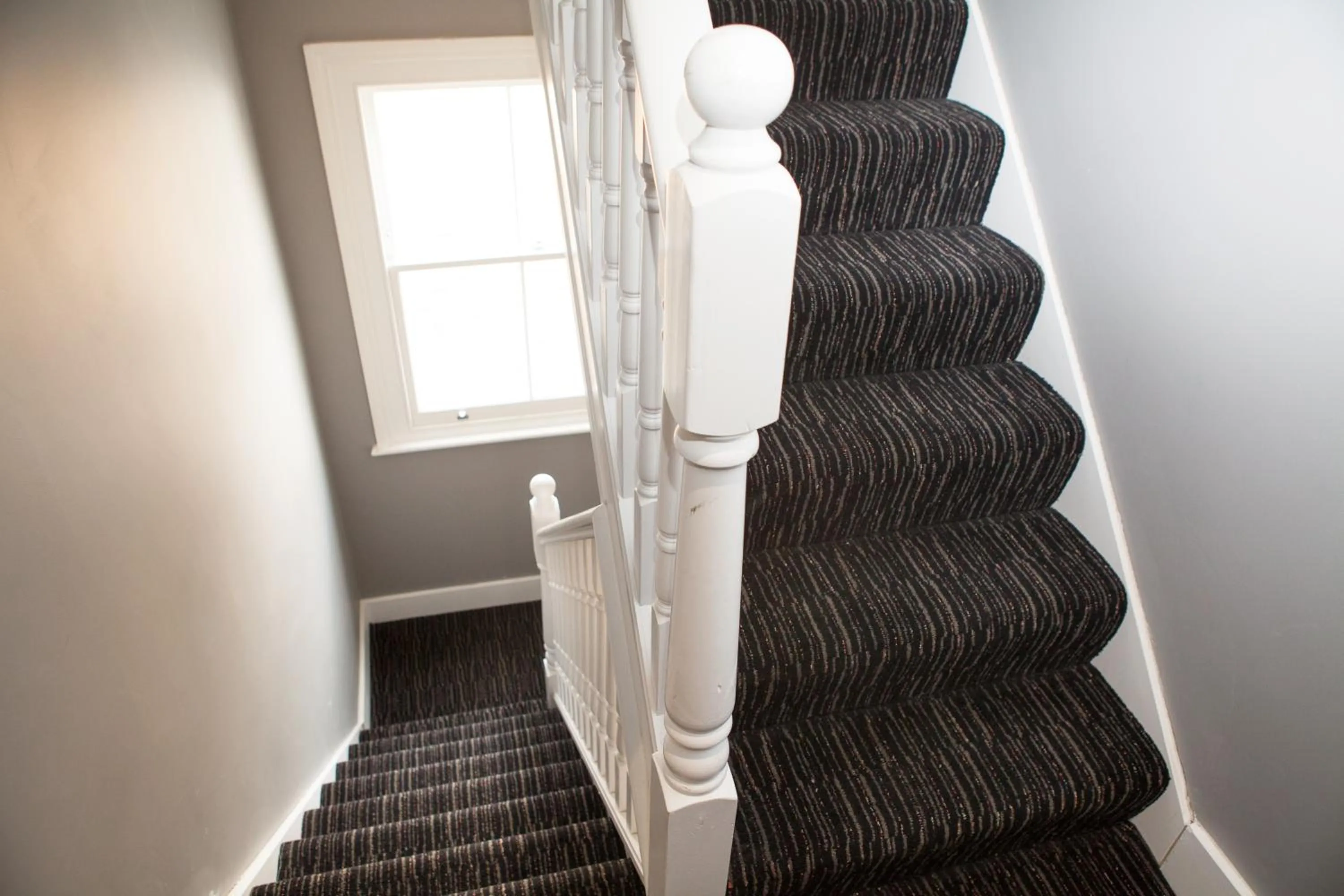 Communal lounge/ TV room in The Tudor Inn Hotel