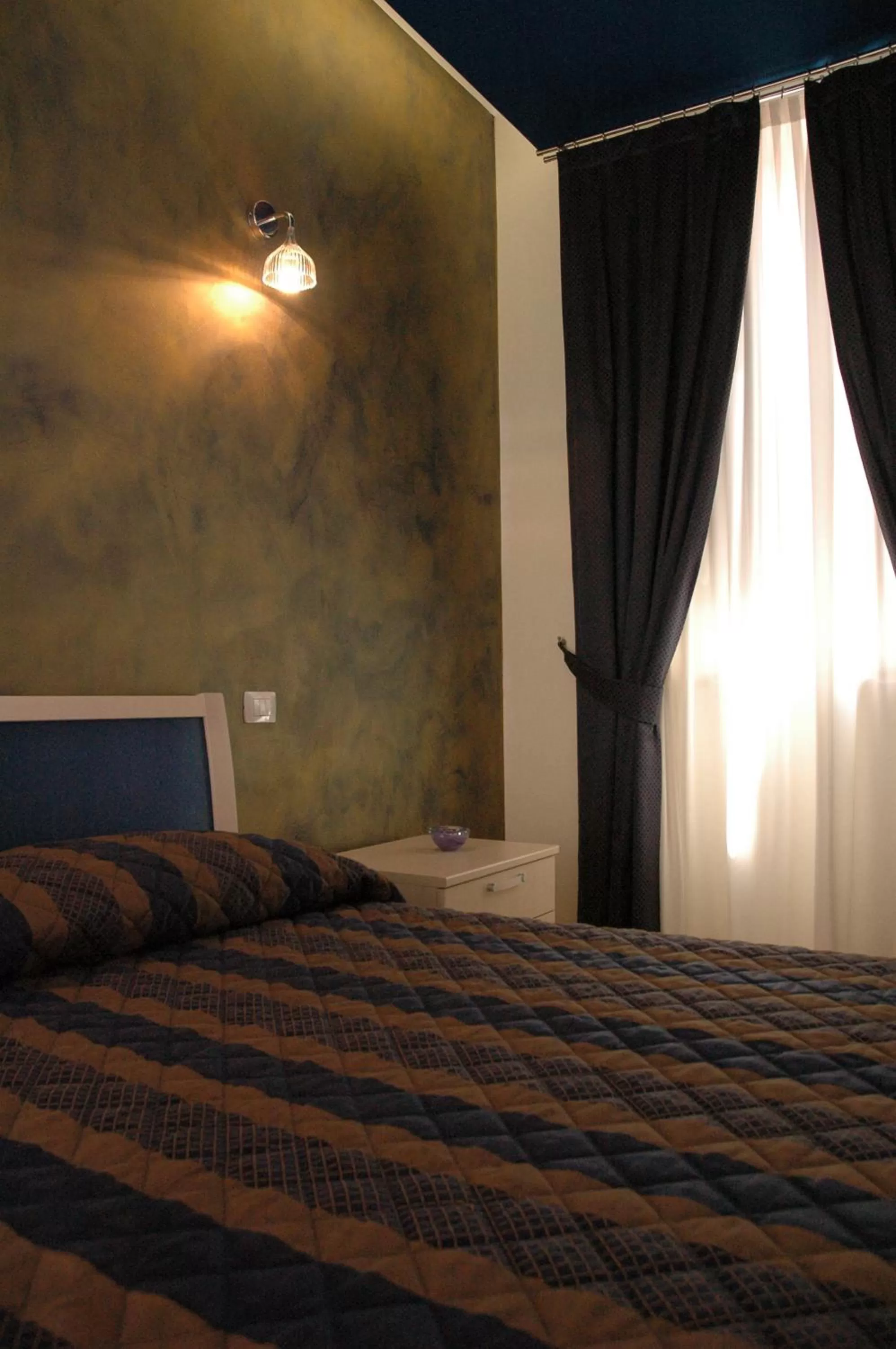 Decorative detail, Bed in Residenza Glave