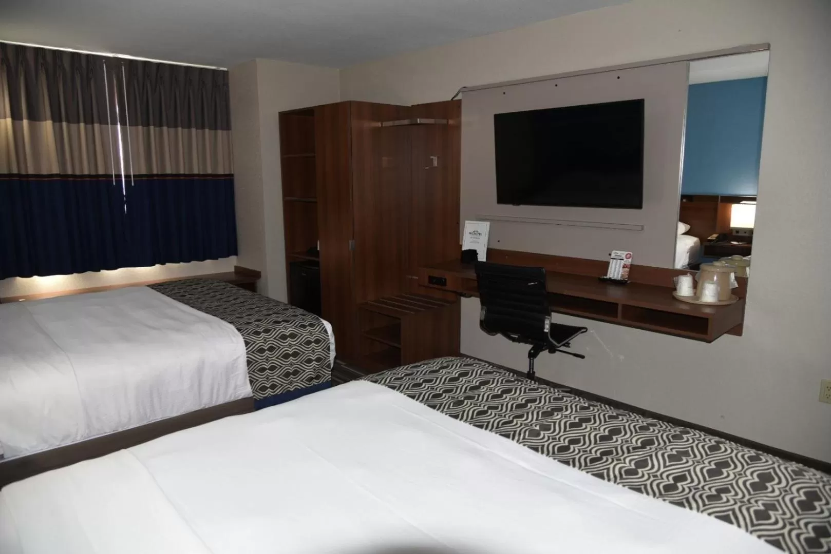 Bed in Microtel Inn & Suites by Wyndham Fond Du Lac