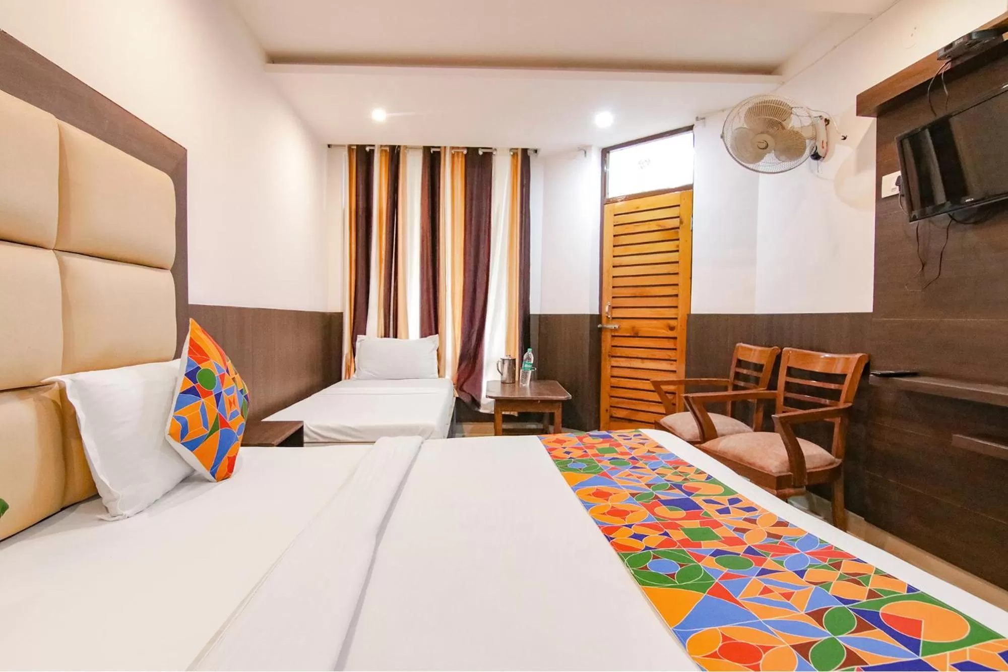 Bed in FabHotel Rosewood Inn I