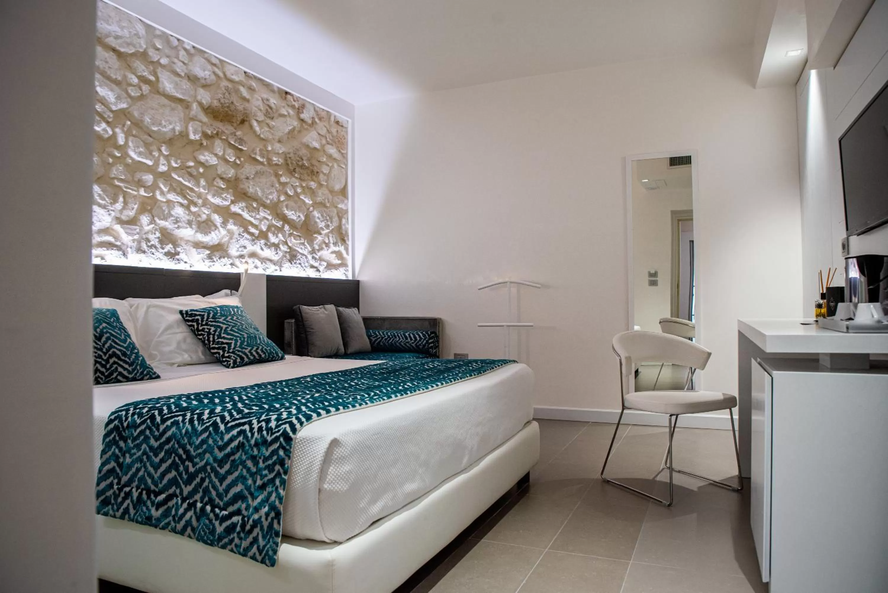 Bedroom in Caportigia Boutique Hotel