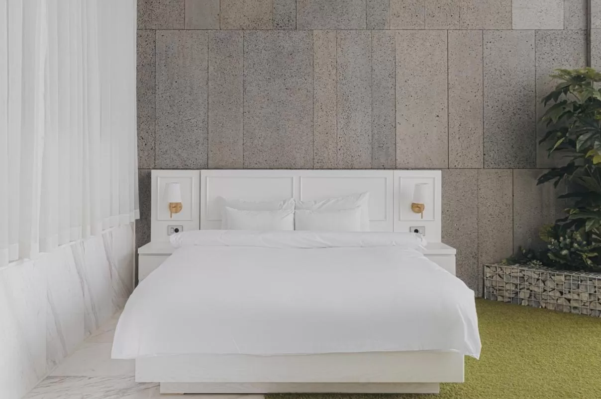 Bed in ACC Design Hotel