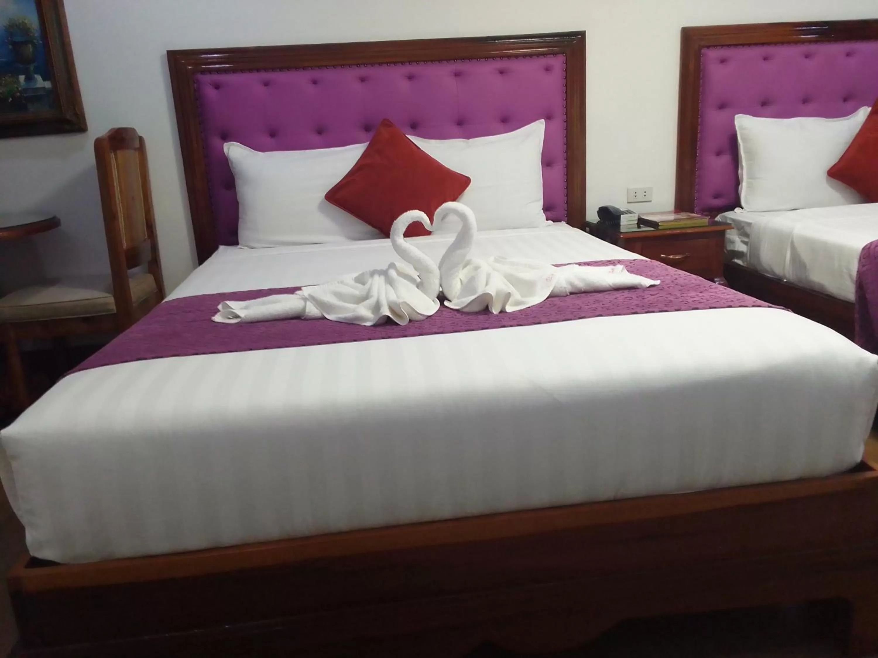 Bed in CLN Boutique Hotel