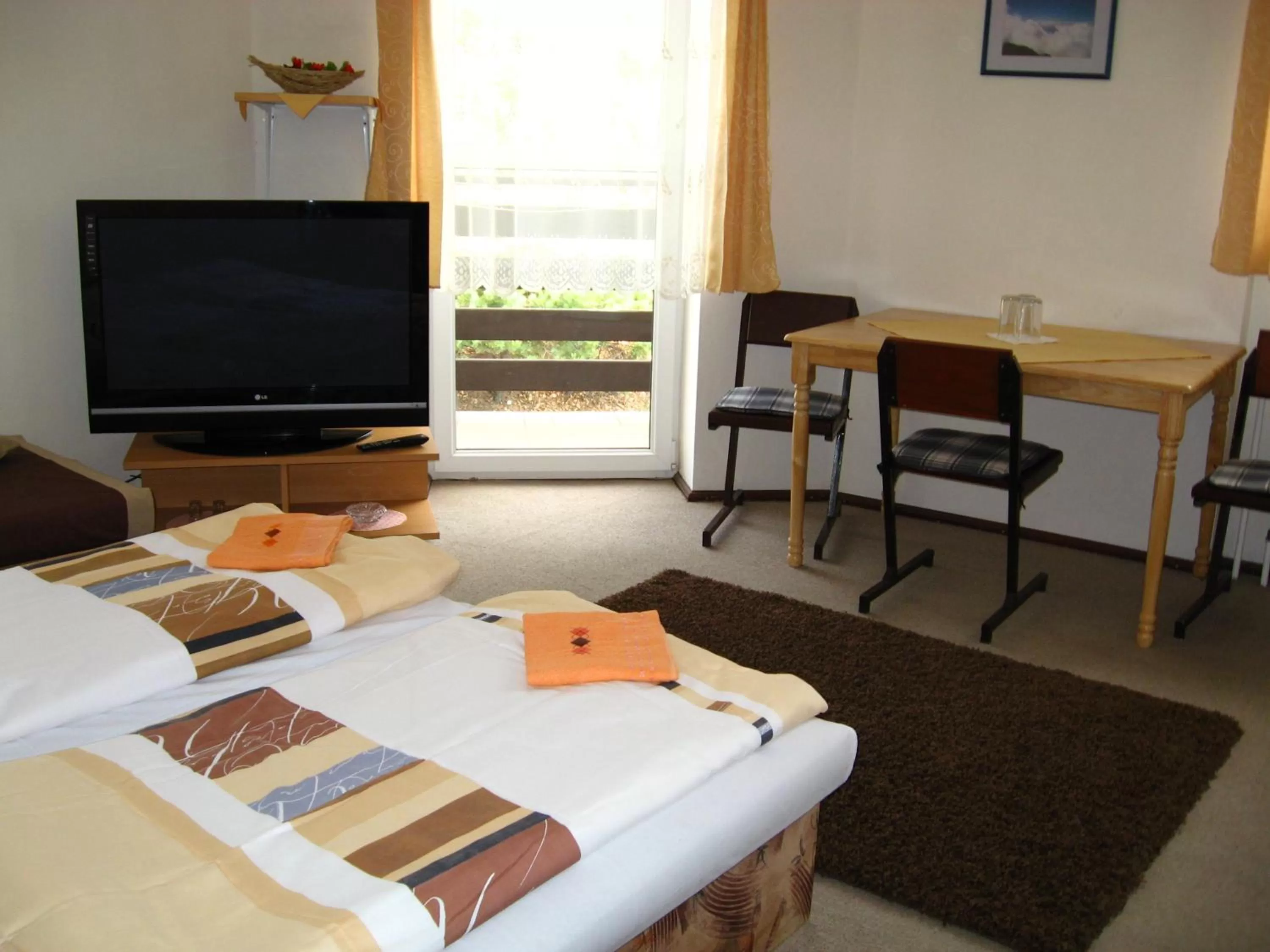 Photo of the whole room, TV/Entertainment Center in Penzión Slávia