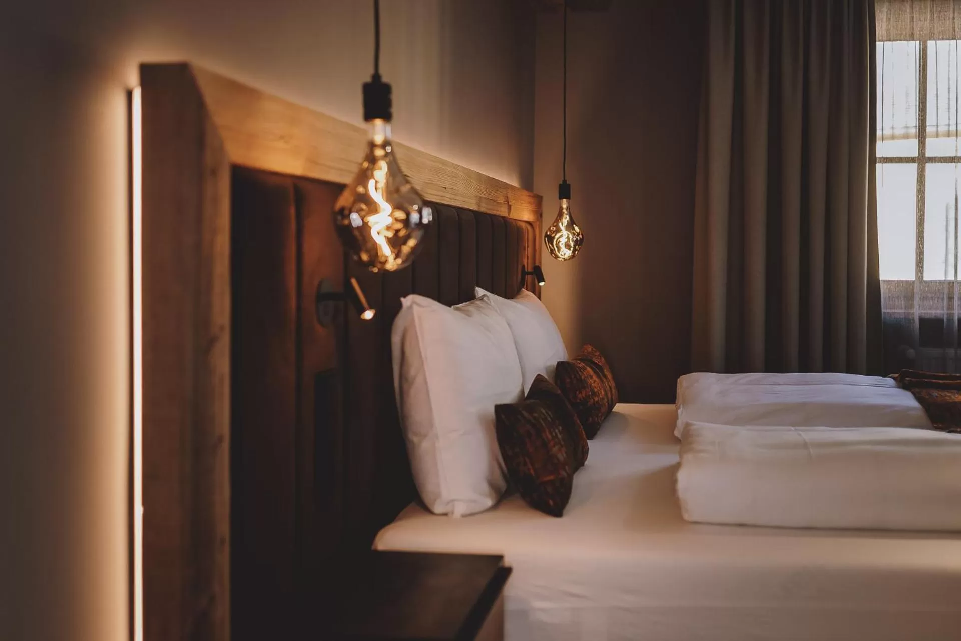 Bed in POST POST Hotel - Alpine Boutique Hotel & Spa