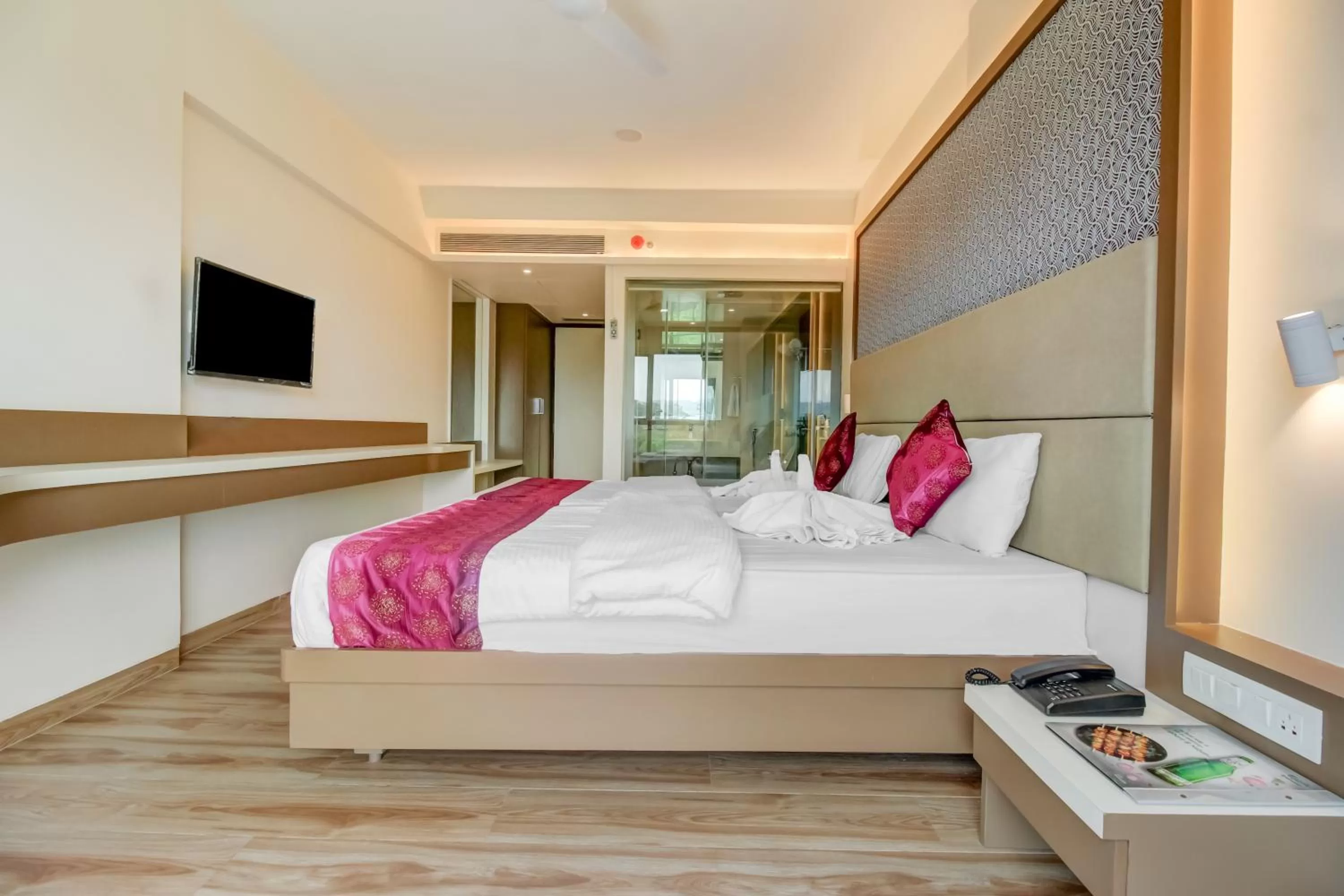 Communal lounge/ TV room, Bed in Grand Mookambika