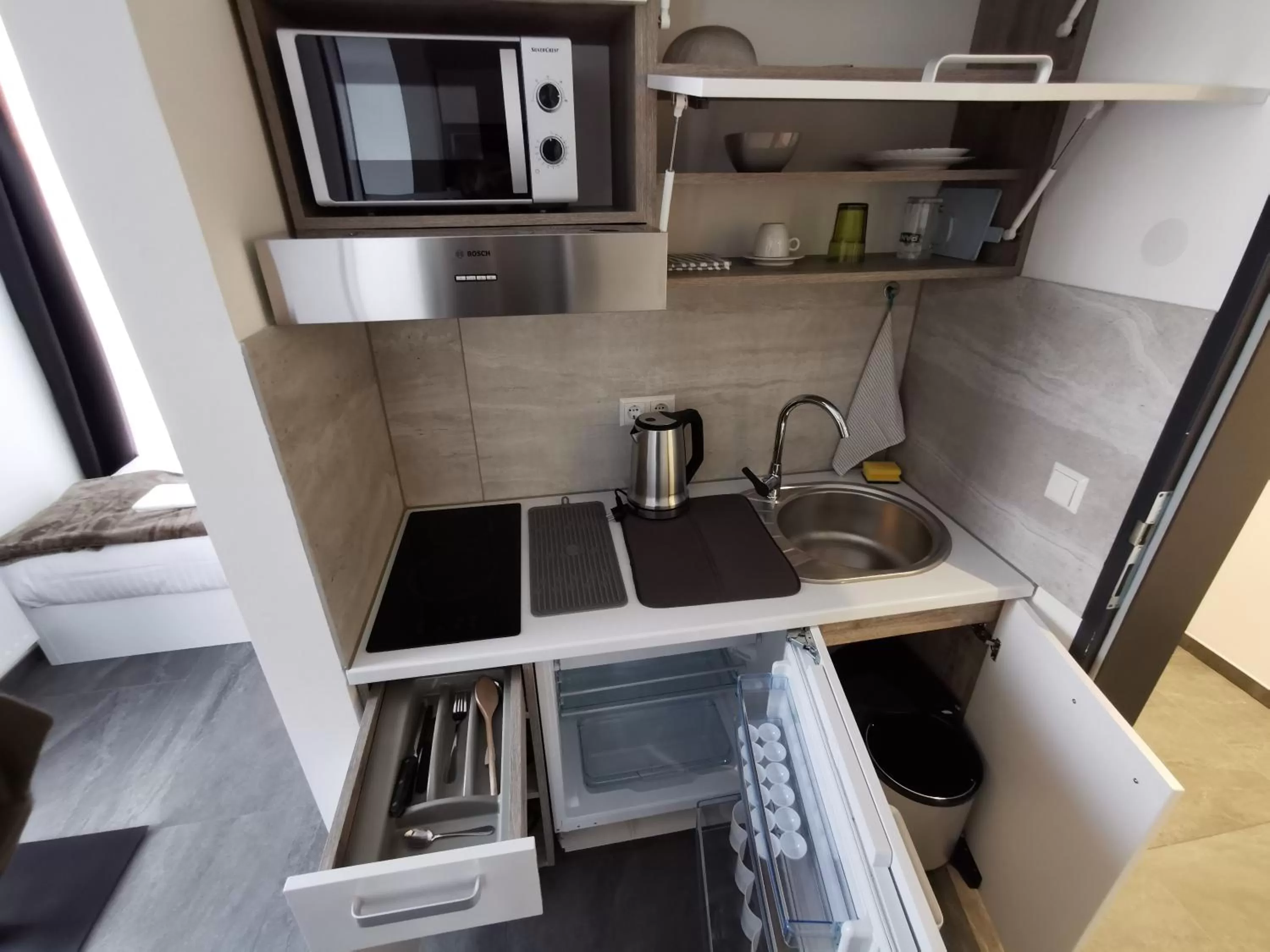 Kitchen or kitchenette in HP Apartments