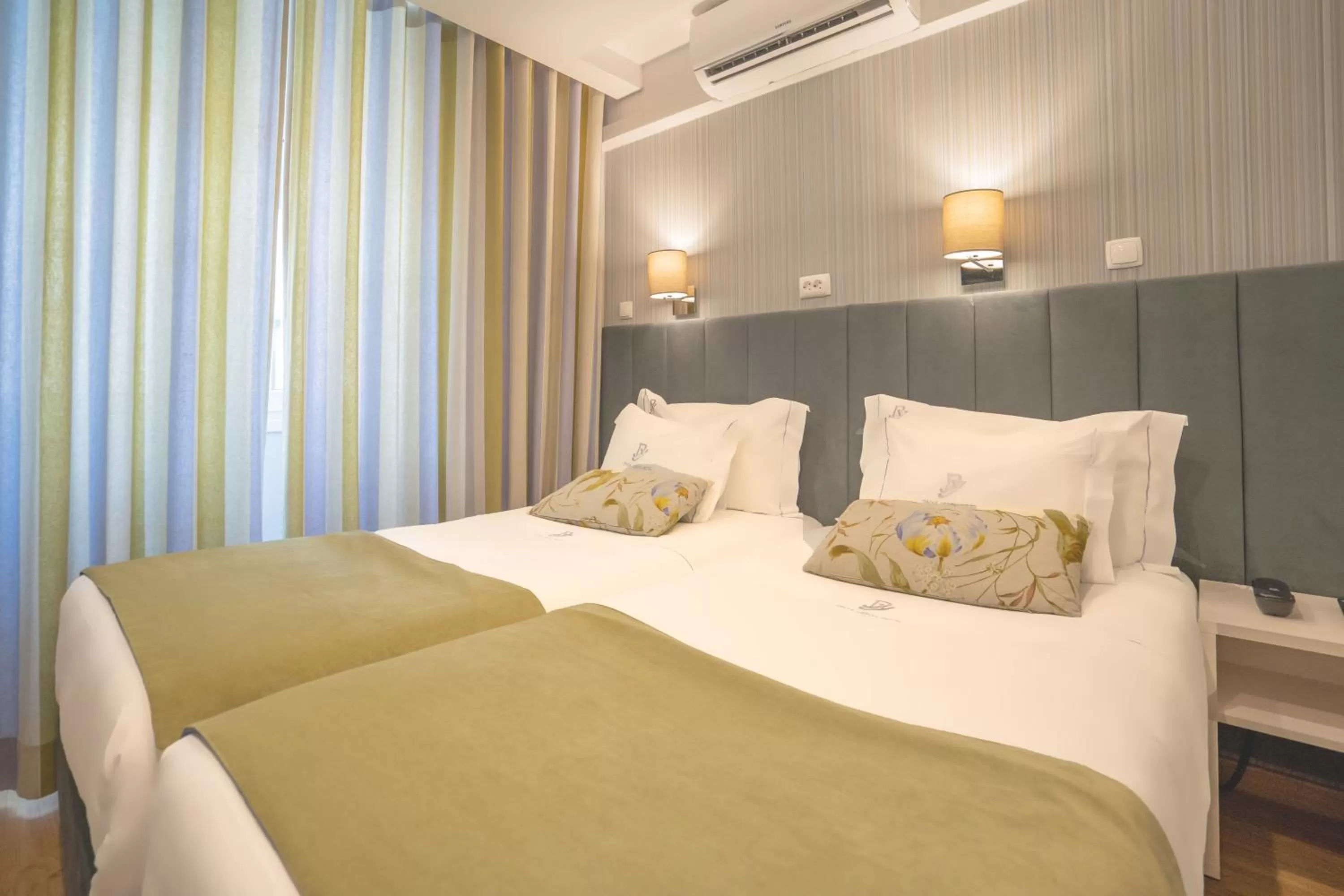 Bed in Dinya Lisbon Hotel