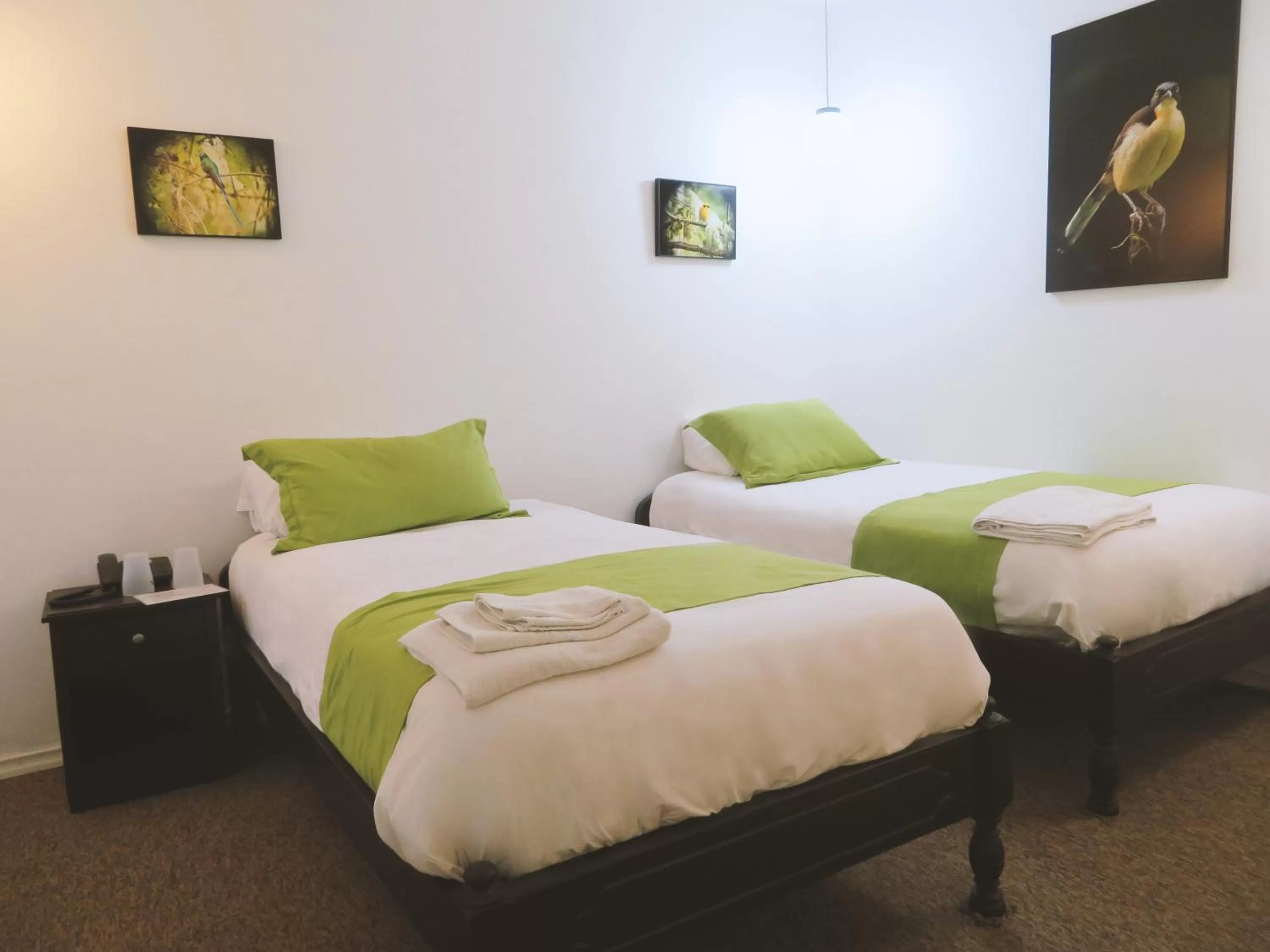 Bed in Bird Garden Guest House