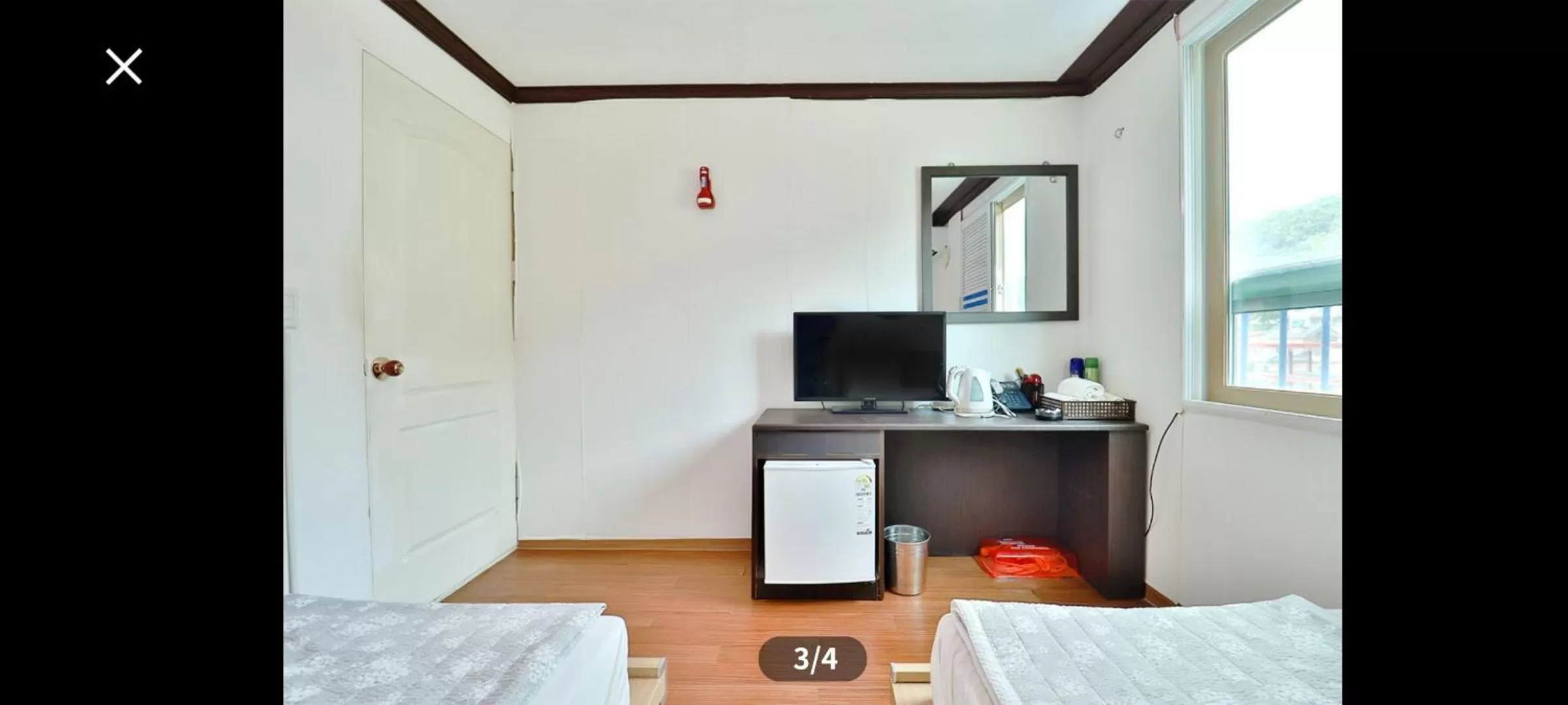 Bed in Saipan Motel with Sea View