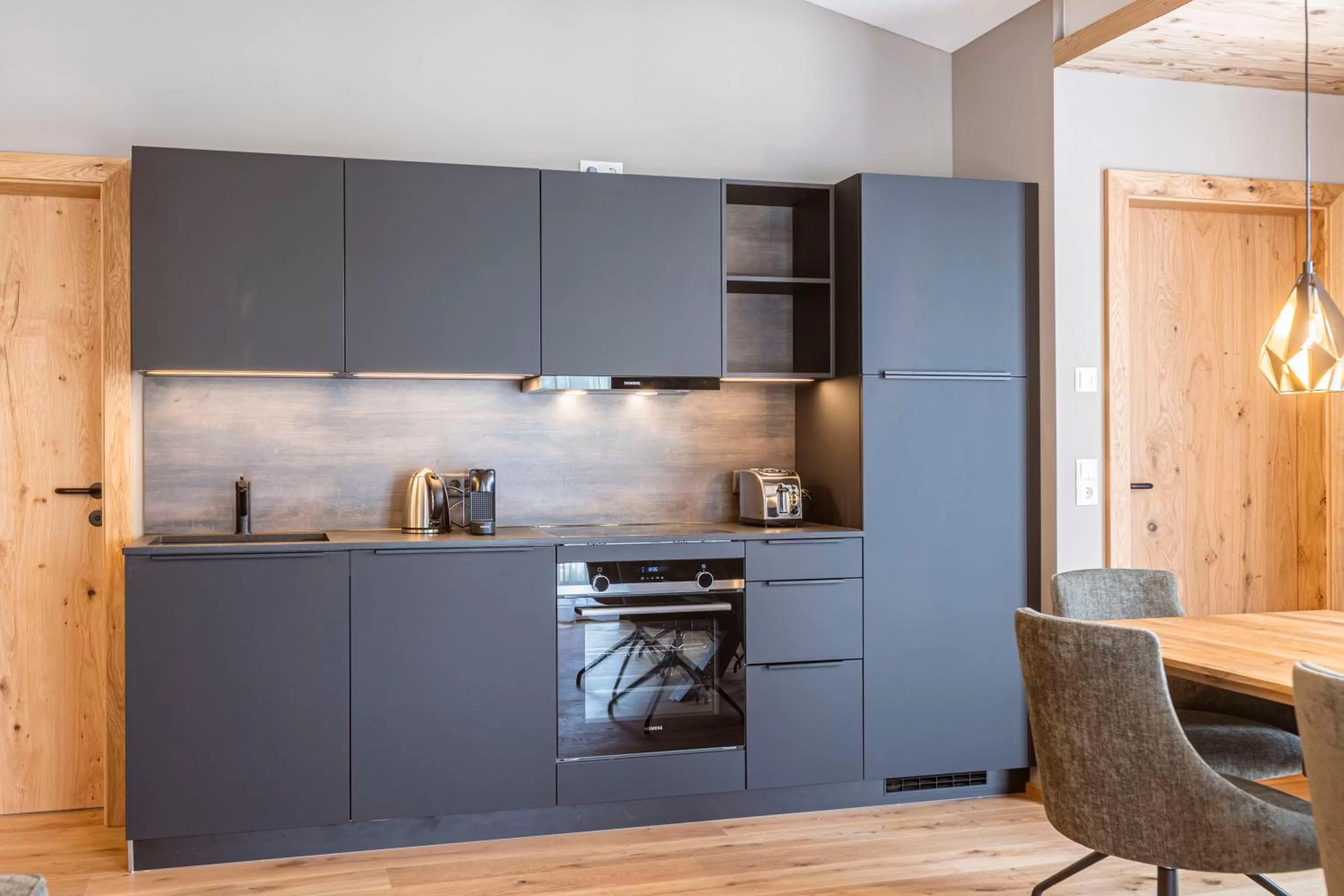 Kitchen or kitchenette in Zillertal Suites Fügen by ALPS RESORTS