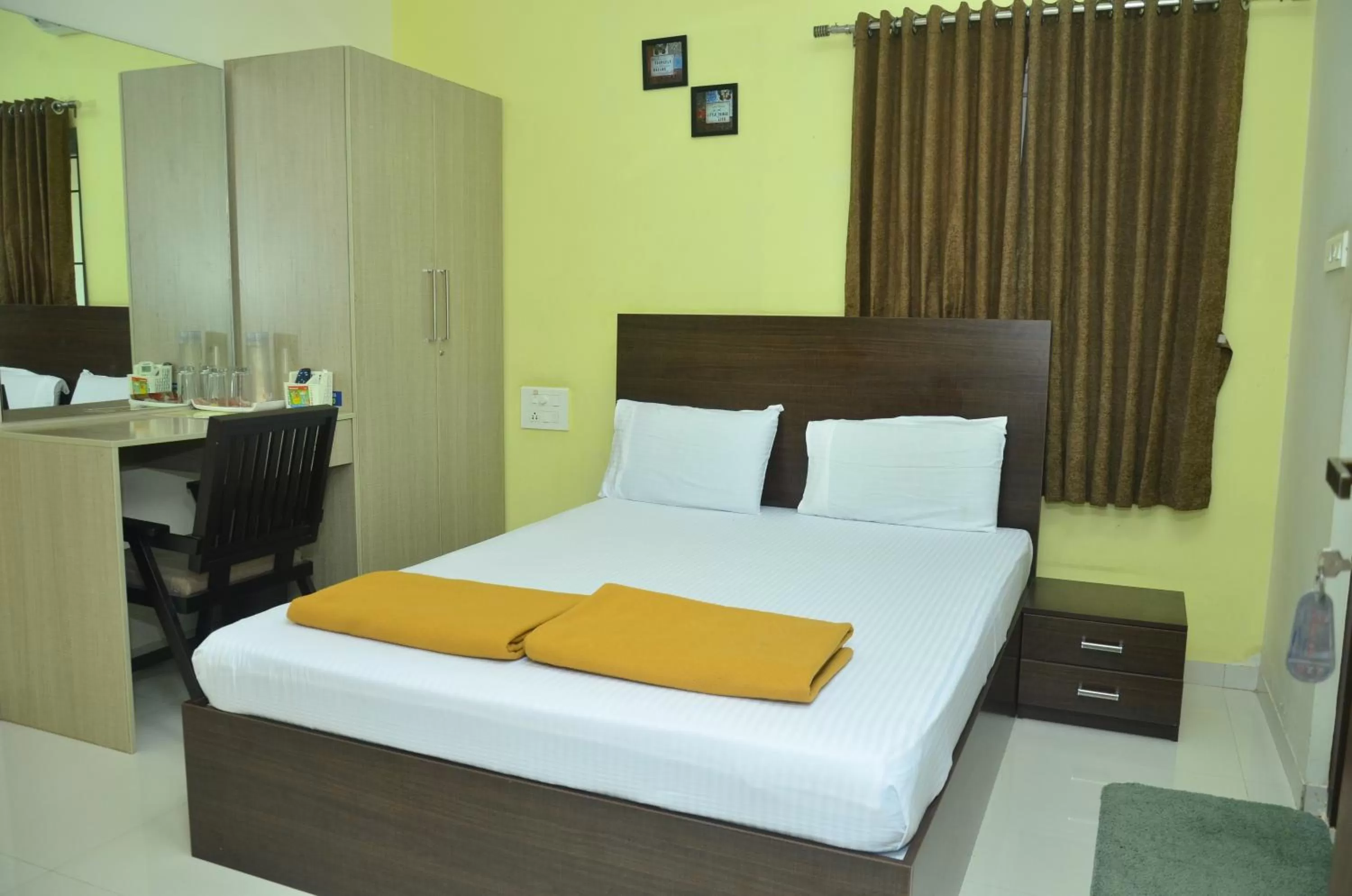 Bed in THE SURRYA MAX RESIDENCY