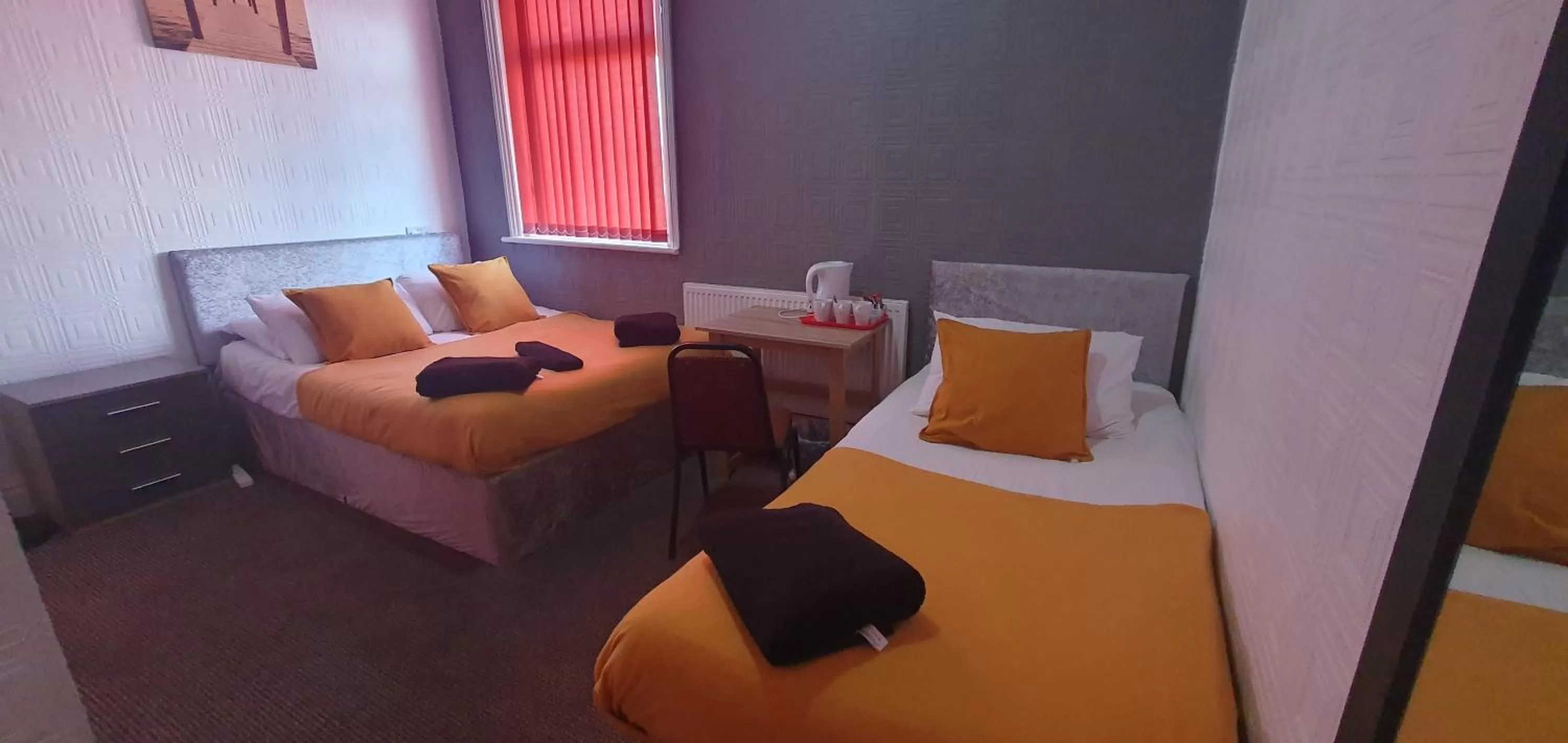 Bed in Palm Beach Hotel by the Sea