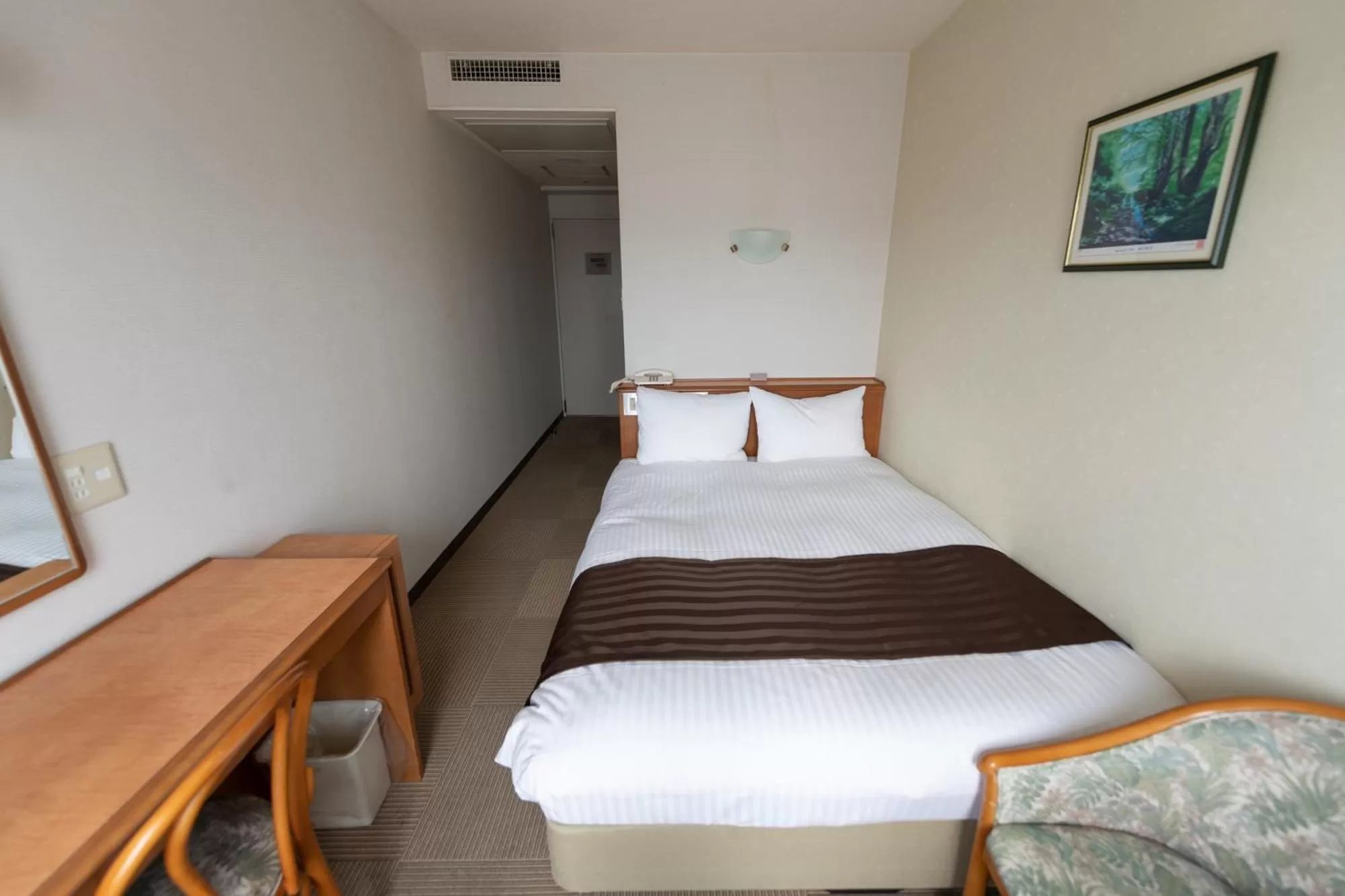 Bed in Tottori City Hotel