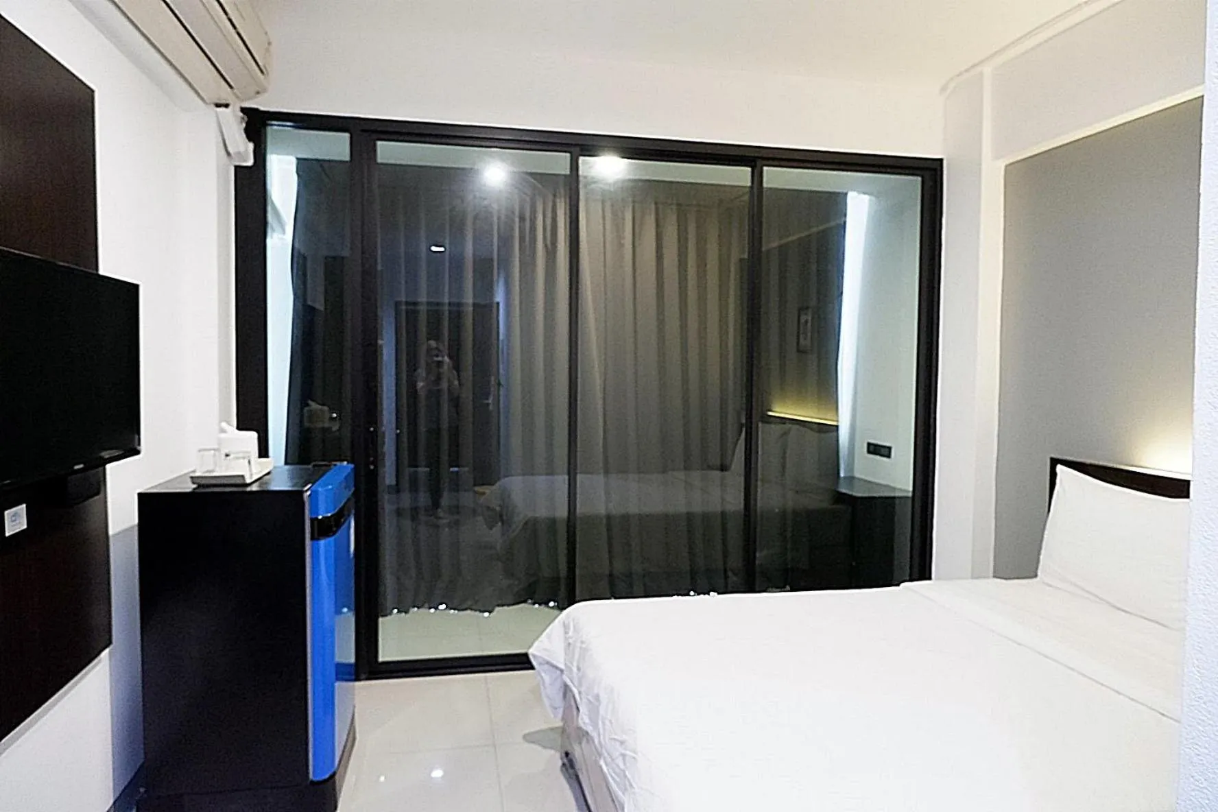 Bed in Izen Budget Hotel & Residence