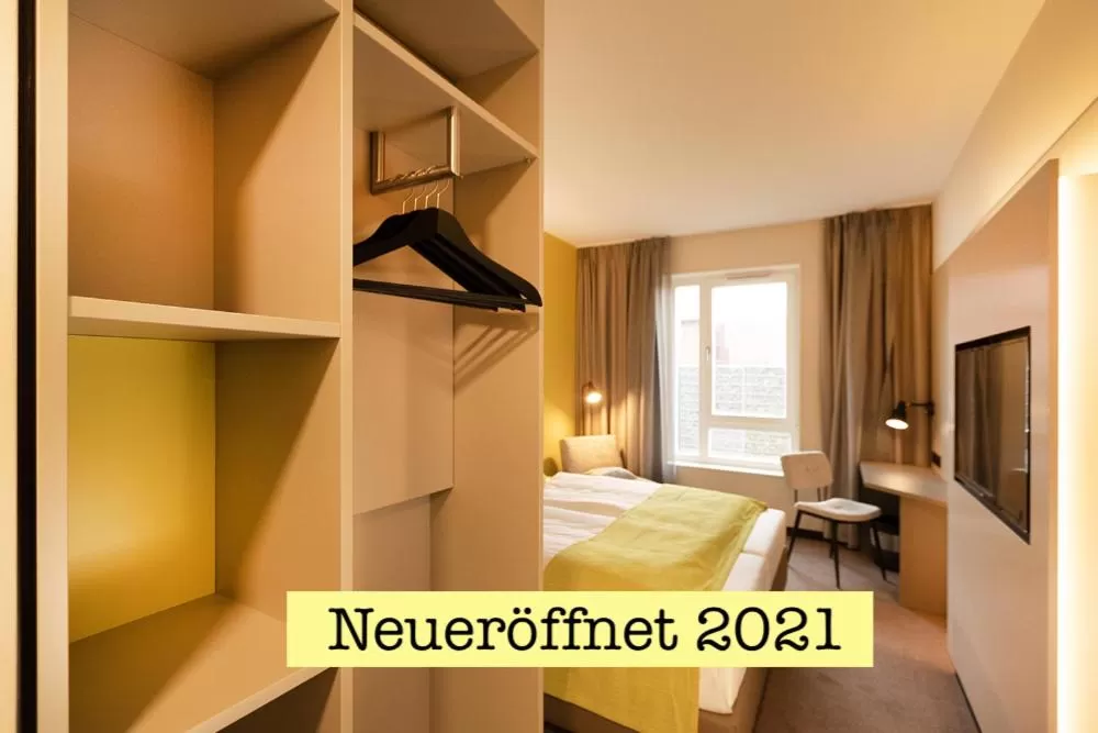 Bed, TV/Entertainment Center in th Hotel Leipzig Messe