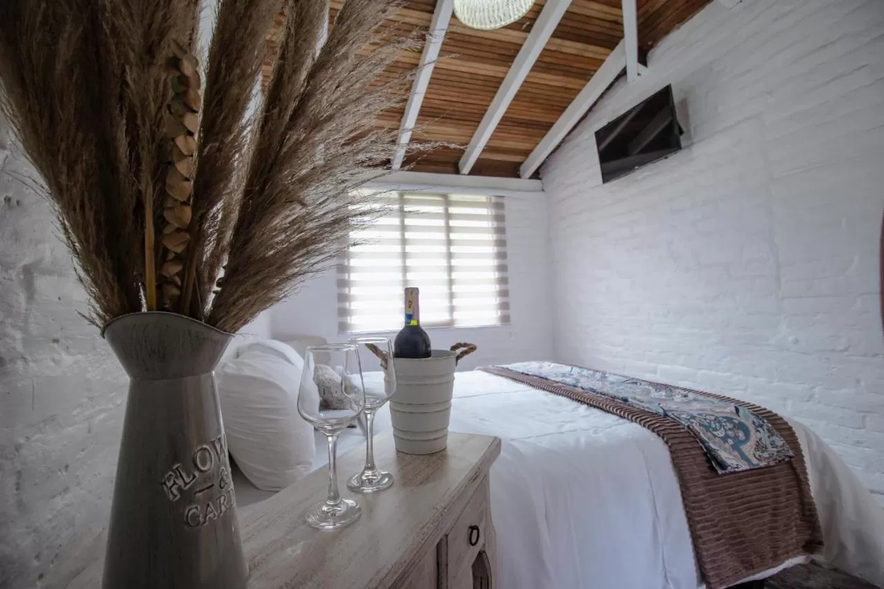 Bed in Rústic Hotel Quinta La Aurora