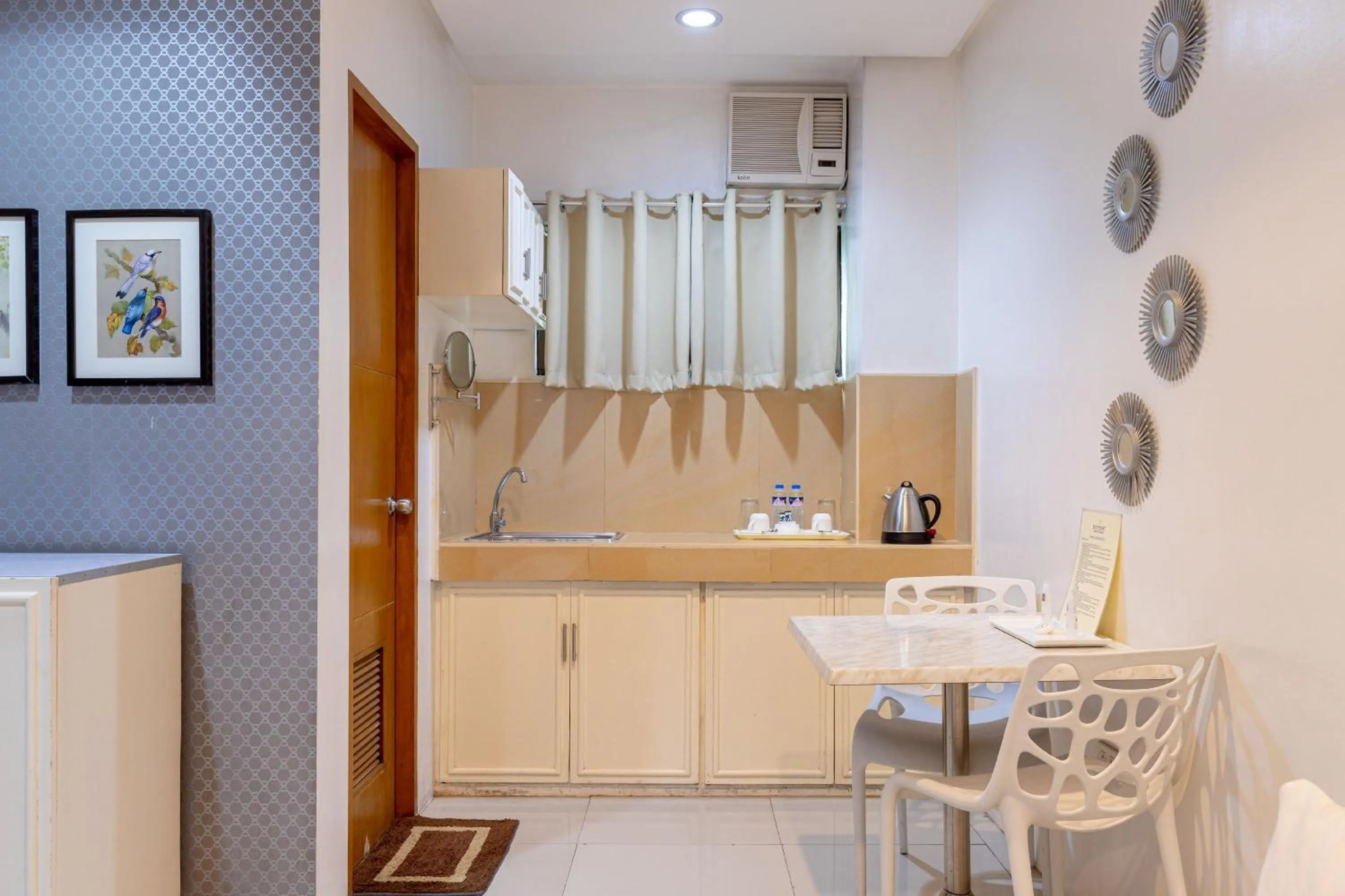 Kitchen or kitchenette in Baymont Suites & Residences