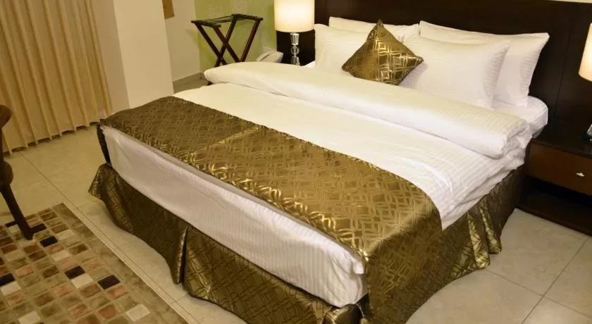 Bed in City Rose Hotel Suites