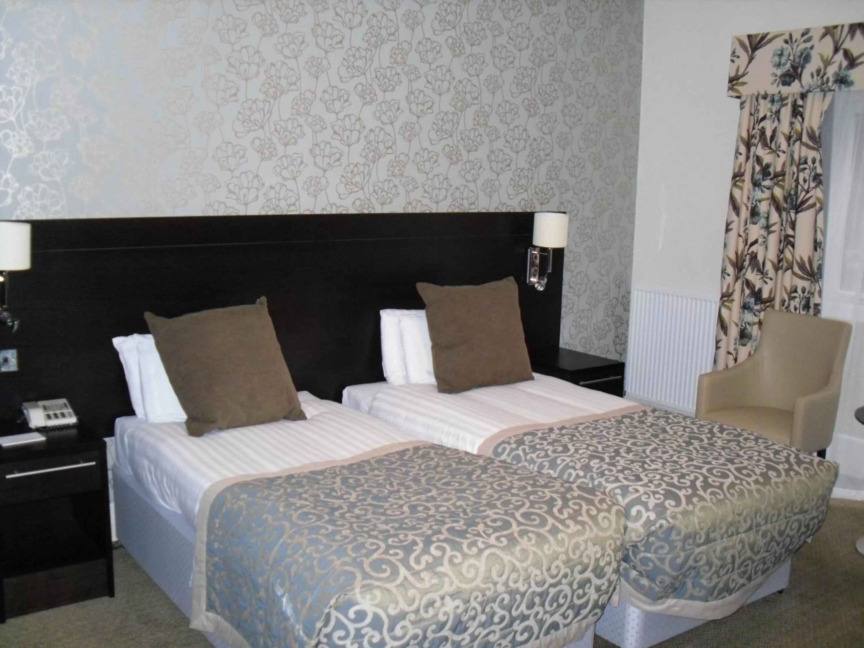 Bed in Norfolk Royale Hotel