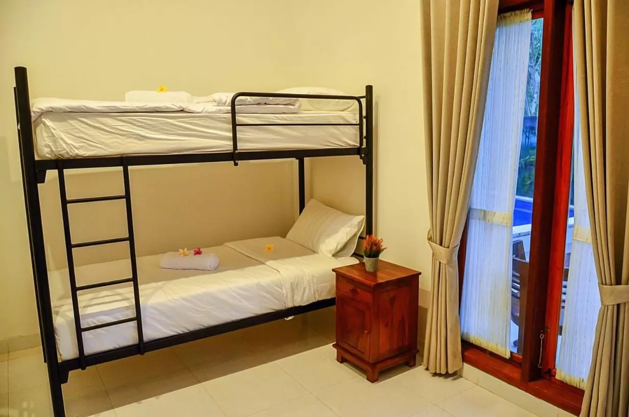 Photo of the whole room, Bed in The Puncak Santhi Inn