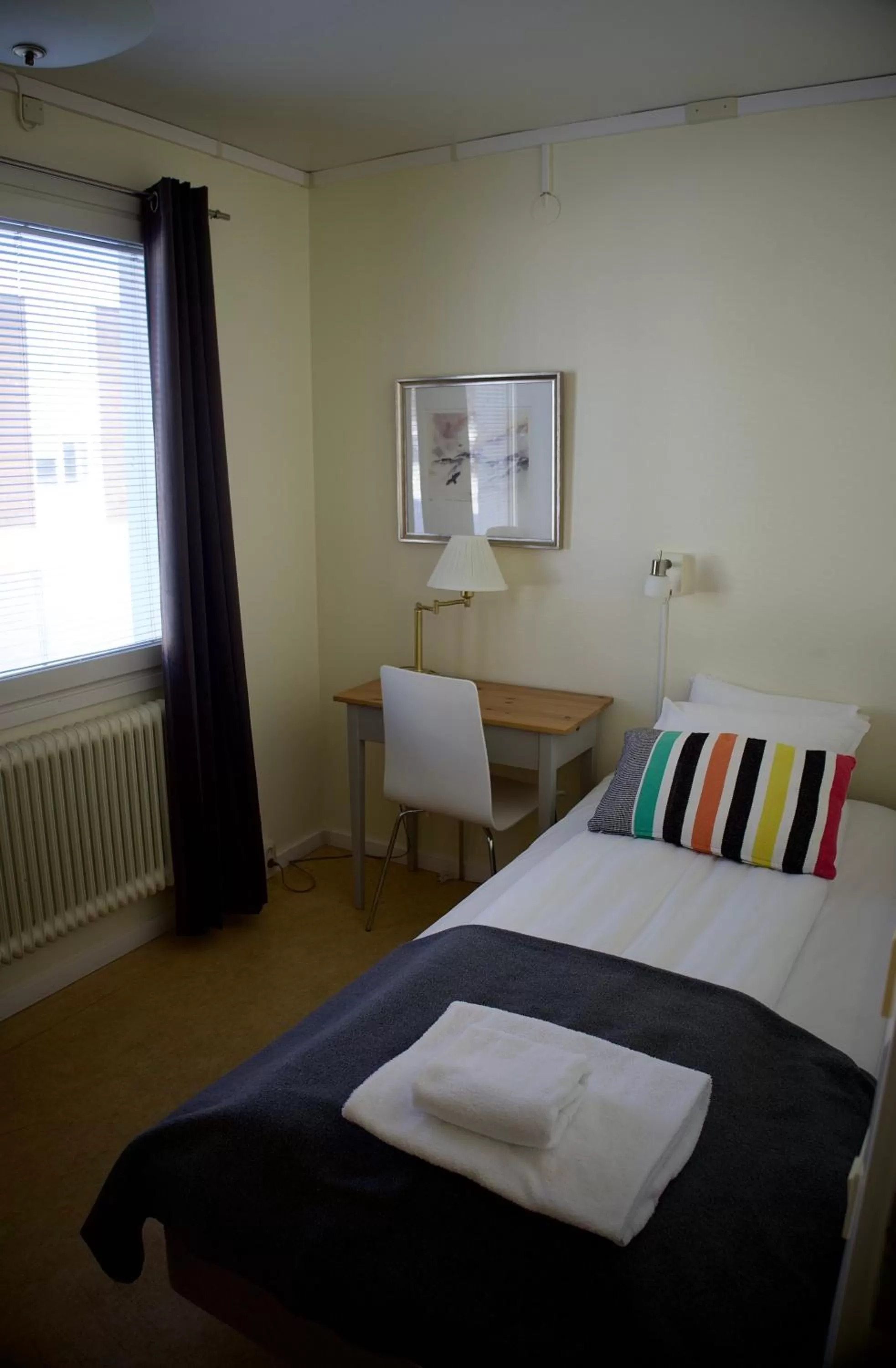 Photo of the whole room, Bed in STF Malmfältens Folkhögskola