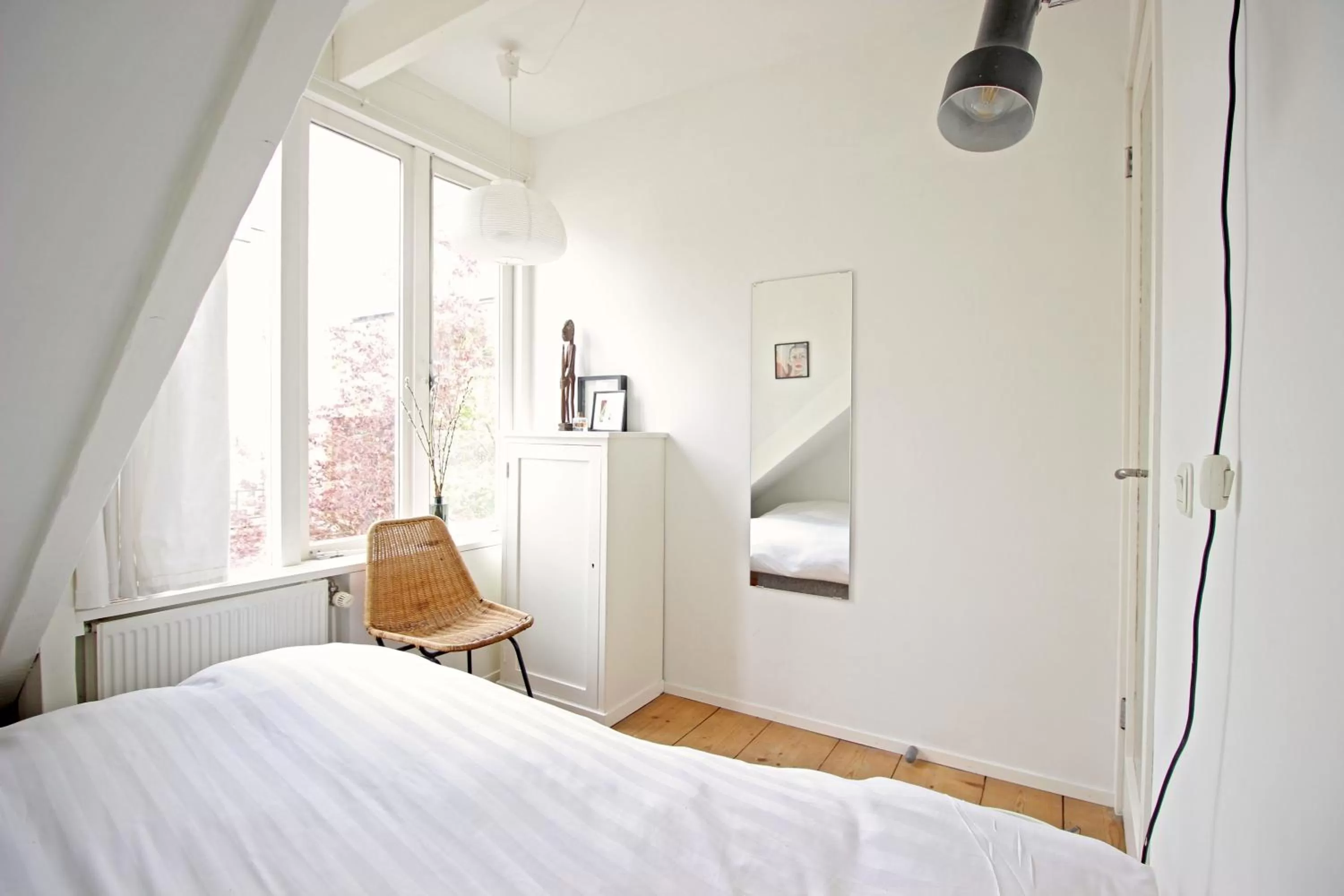Bed in Beautiful 2 floor Vondelpark apartment.