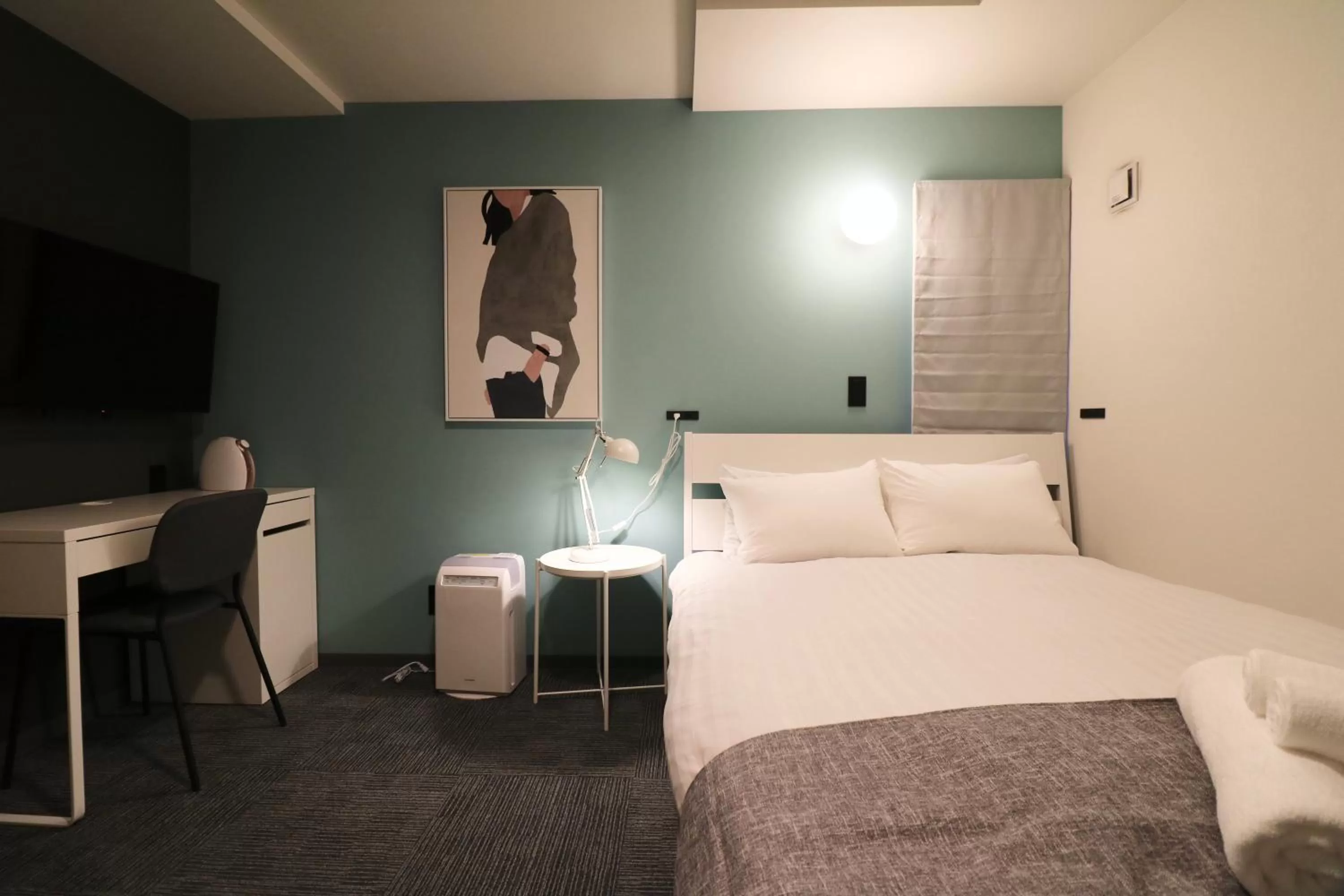 Bed in TAKETO STAY PREMIERE SAPPORO Eki