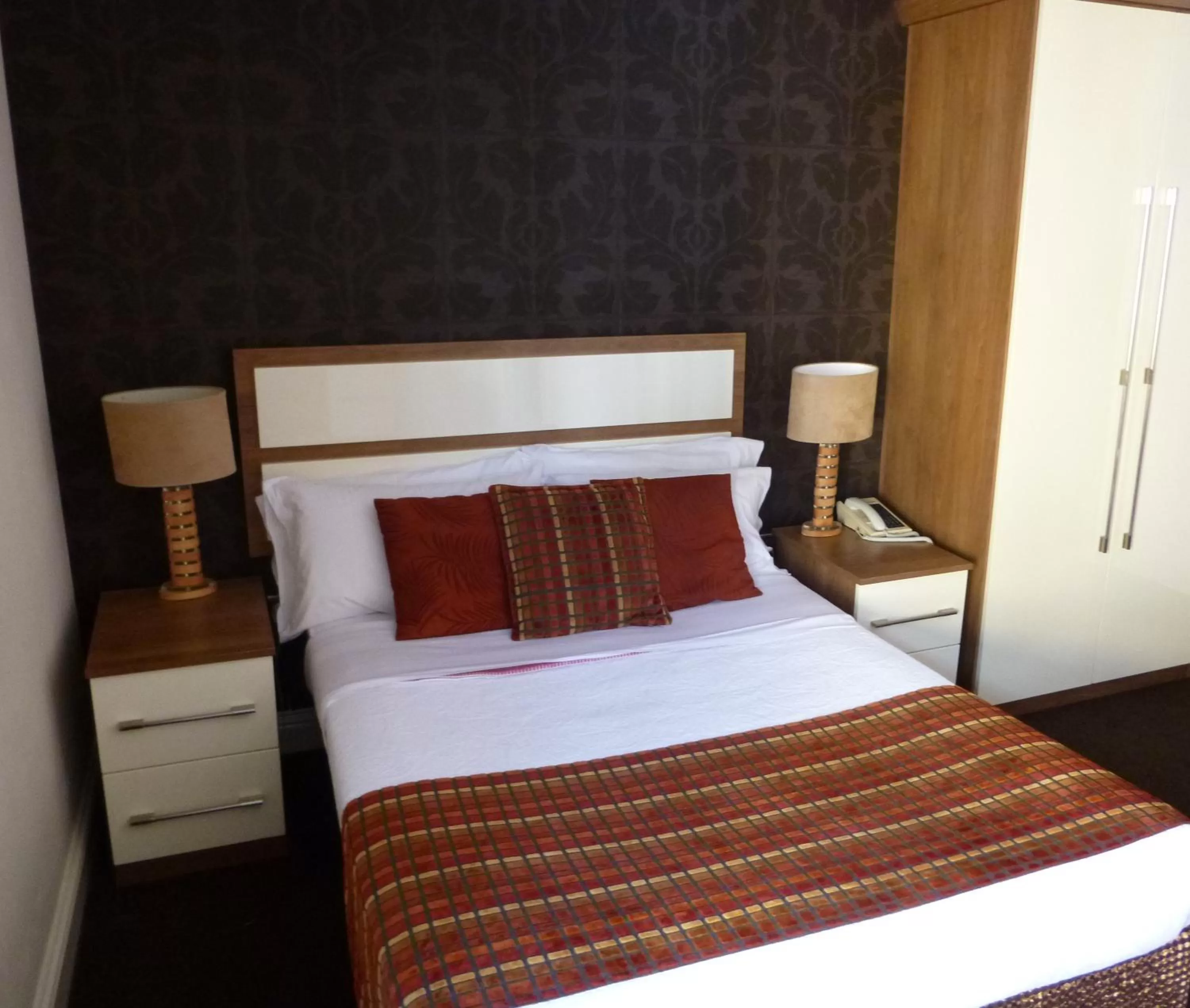 Bed in The White Lady Hotel