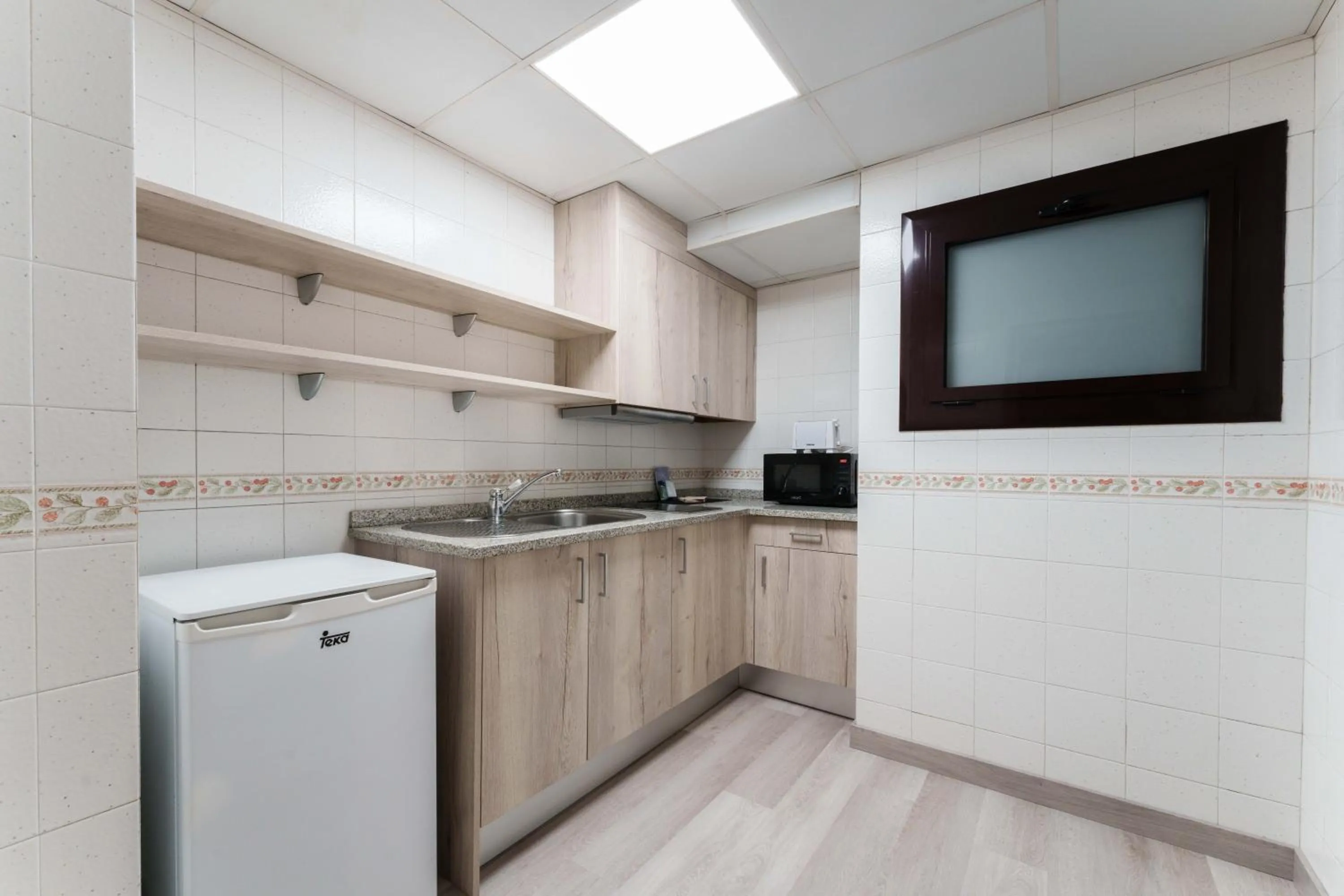 Kitchen or kitchenette in Hotel & Aparthotel Cosmos