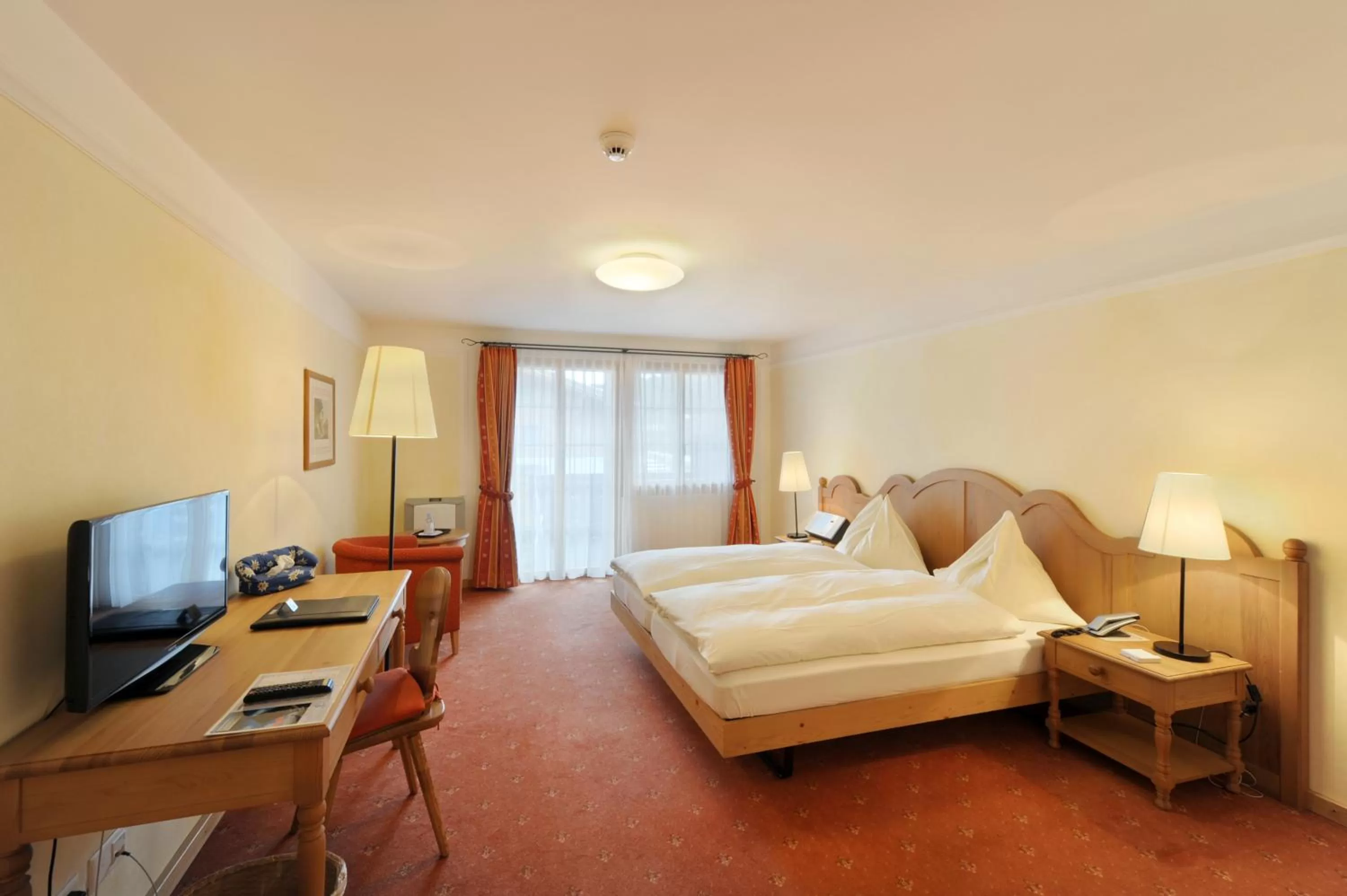 Photo of the whole room, Bed in Hotel Bellerive Gstaad