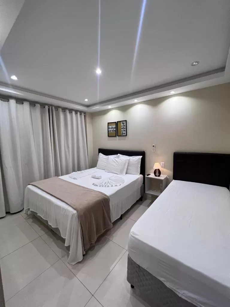 Bed in Pousada Arraial Tropical