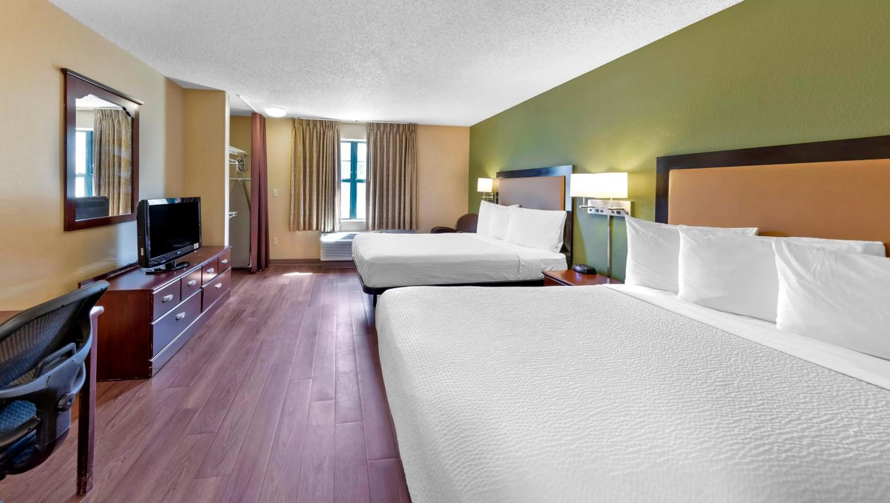 Bedroom, Bed in Home 1 Suites Extended Stay