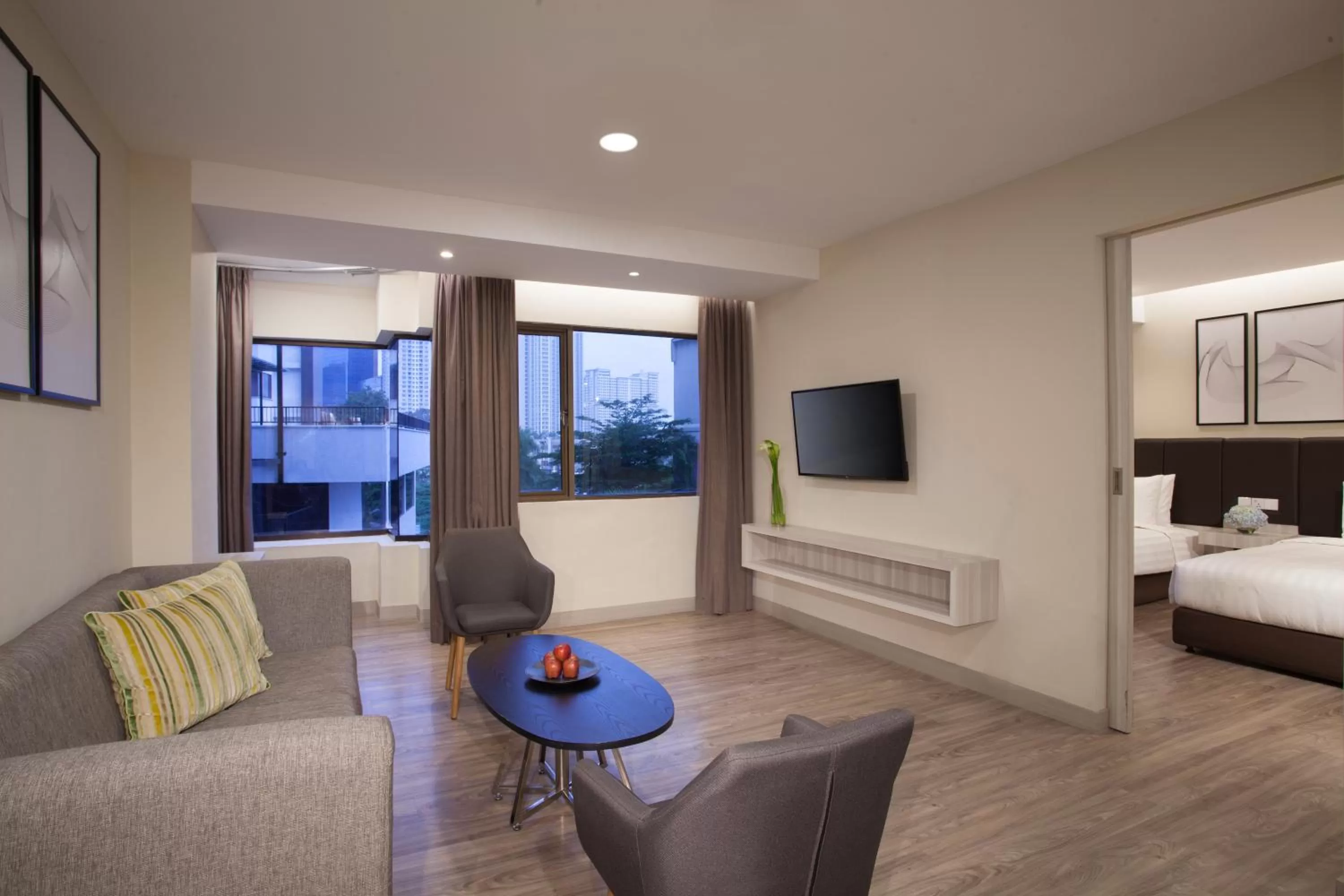 Living room, Bed in AIHO Hotel Medan