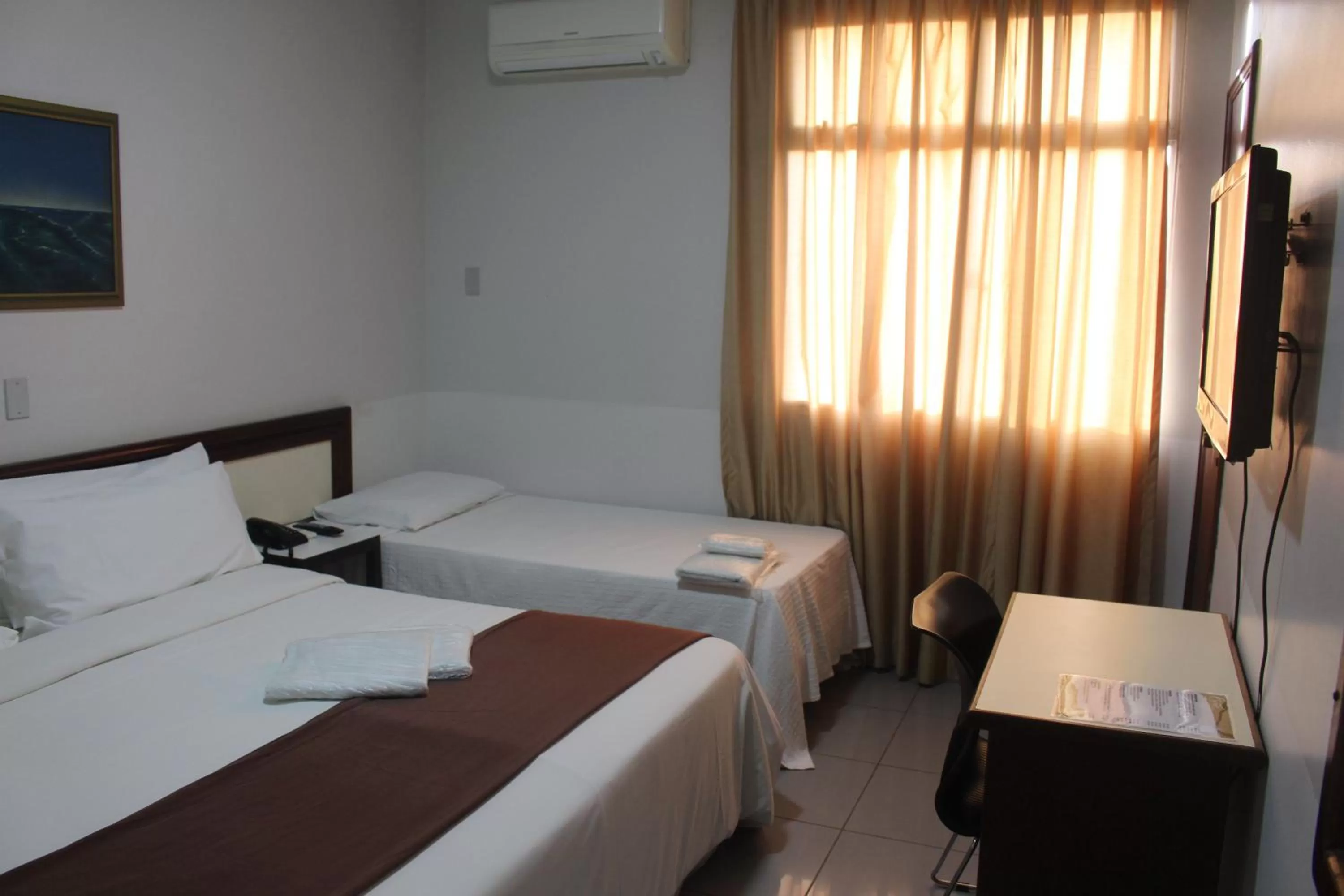 Bed in Hotel Oscar Econômico